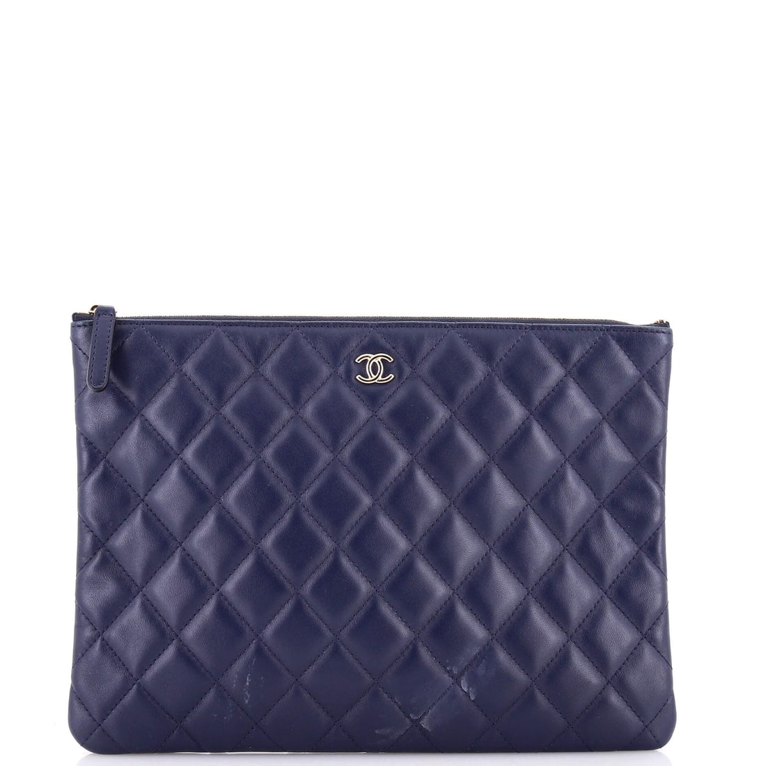 Chanel O Case Clutch Quilted Lambskin: Zip pouches like the O Case exist to bring order to a larger bag, and this middle size does that before it does anything else. At 10.5 in wide x 8 in high x 1 in deep it holds a notebook, cables and c