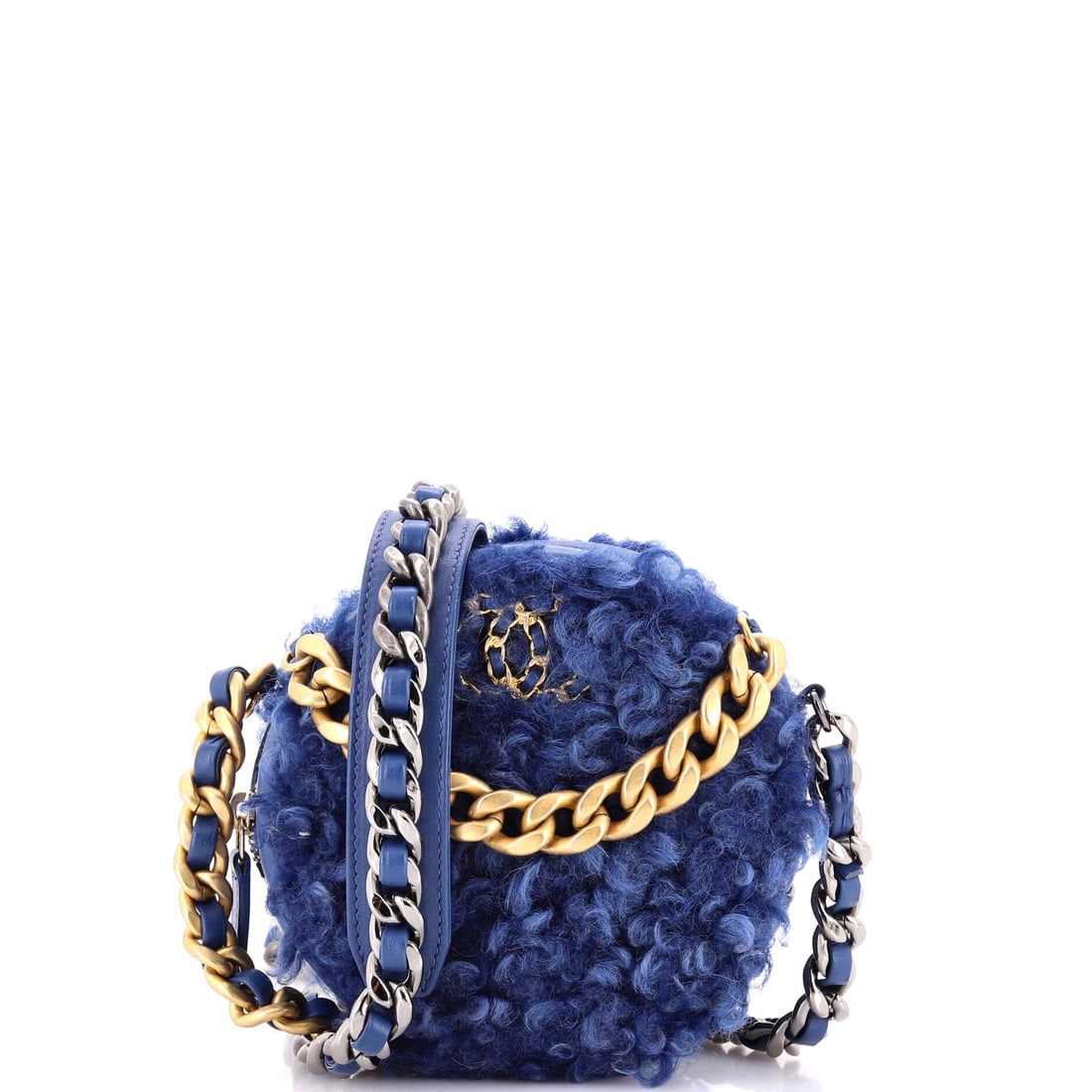 Chanel 19 Round Clutch with Chain Quilted Shearling: Quilted shearling changes the character of the 19 round clutch entirely, plush where the leather version is crisp, the stitching sinking into the pile instead of standing on it. The round body measure