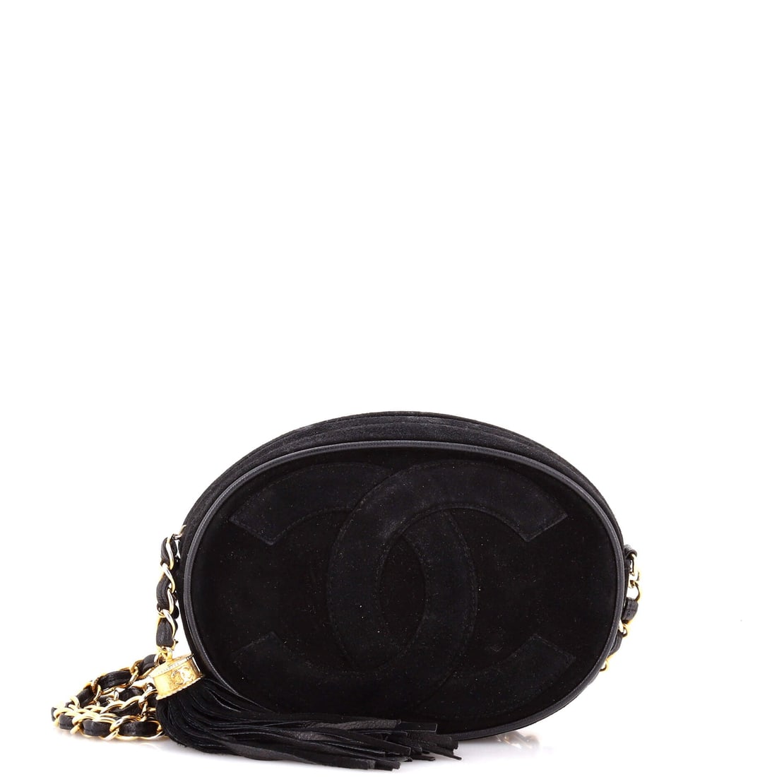 Chanel Vintage Oval CC Tassel Crossbody Bag Suede: Made as a light crossbody, this vintage oval CC bag keeps a 7 in wide, 5 in high and 2 in deep footprint close to the ribs on a 17 in strap drop, high and hands-free. It comes in at Grade C - Very