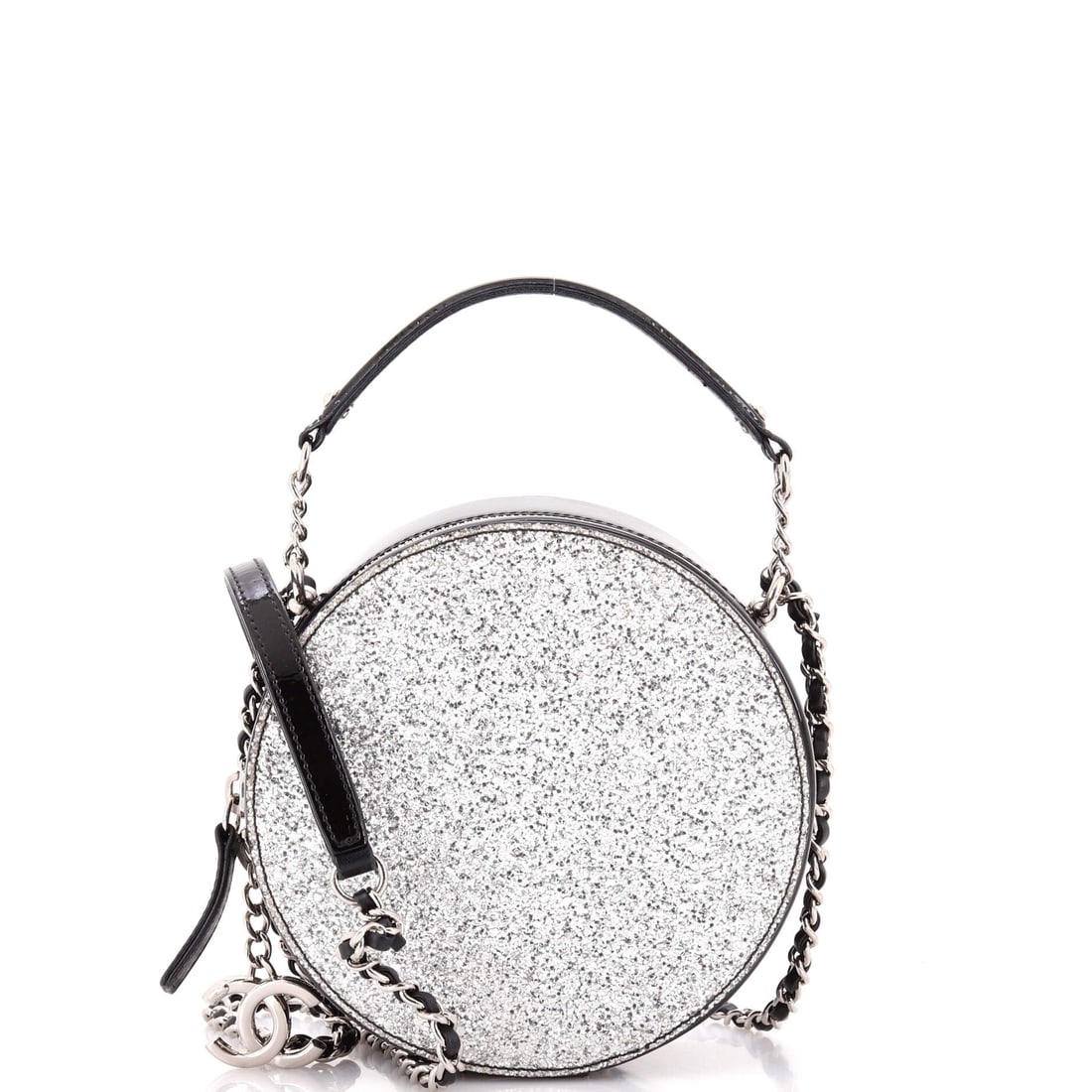 Chanel Evening On The Moon Round Evening Bag Glittered PVC with Patent: Glittered PVC does something patent alone cannot, throwing light in points rather than one broad sheen, with patent trim framing the effect. Round evening shape holds 6 in across, 6 in high and 3 in d