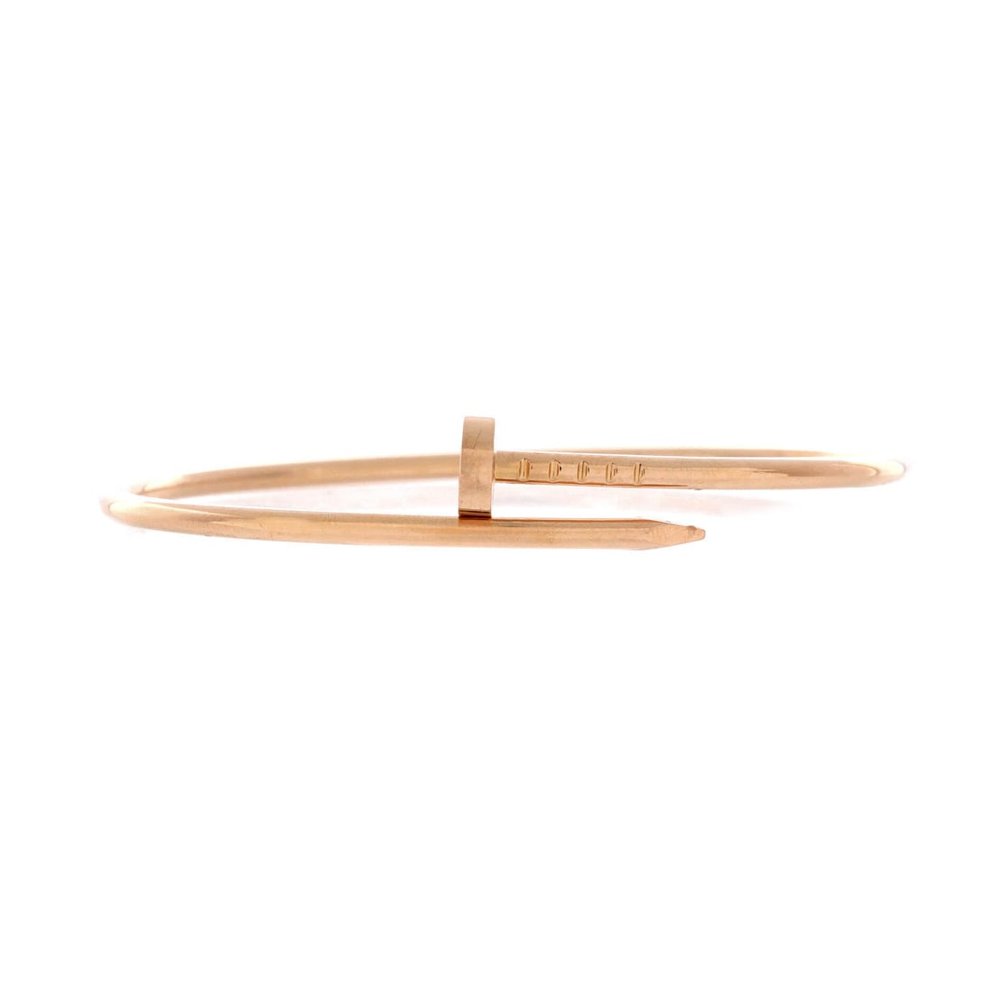 Cartier Juste un Clou Bracelet 18K Rose Gold: Cartier's wrapped-nail motif reads warm in rose gold, the flattened head and tapered point meeting across the wrist in one continuous curve. At 2.5 mm the shank is deliberately slim, sitting flat enou