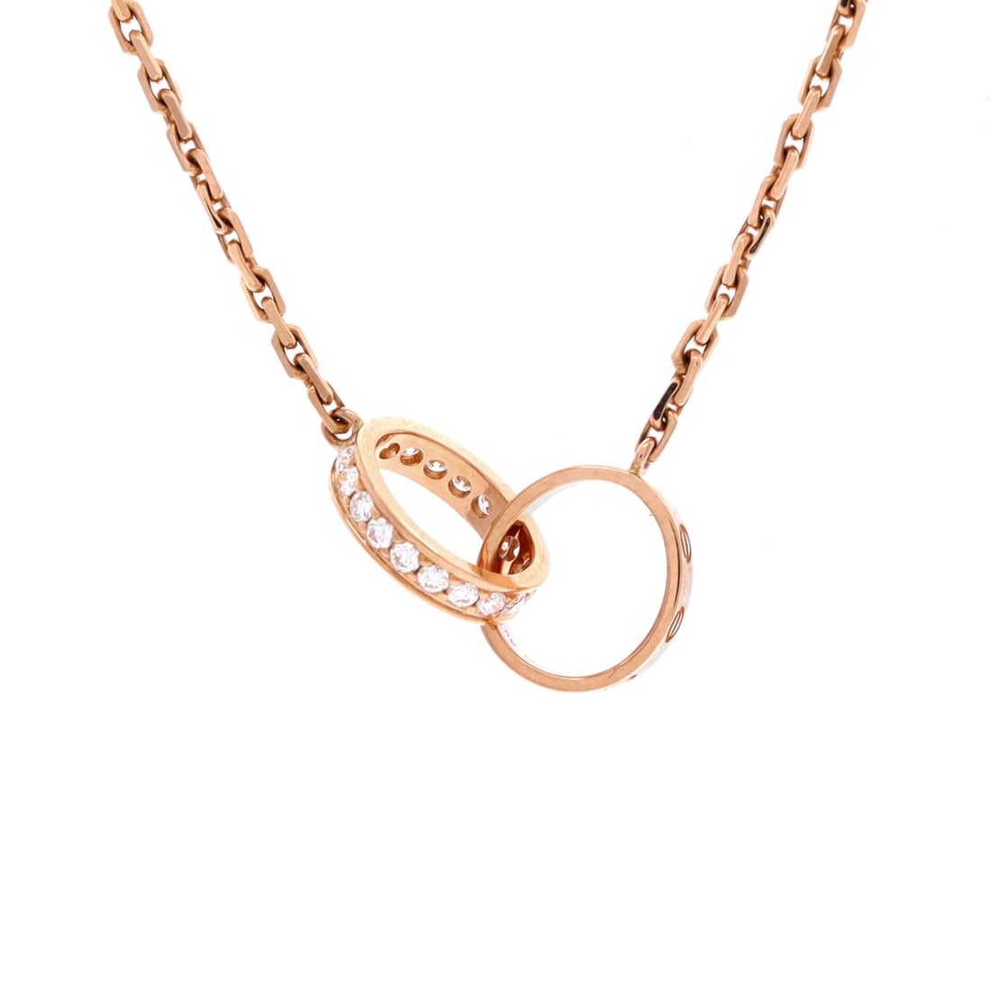 Cartier Love Interlocking Necklace 18K Rose Gold with Diamonds: Set with diamonds on 18K rose gold, this Love Interlocking necklace is the dressier reading of a piece most bidders know in plain metal. Graded at the top of the scale, Grade A - Pristine. The pendant