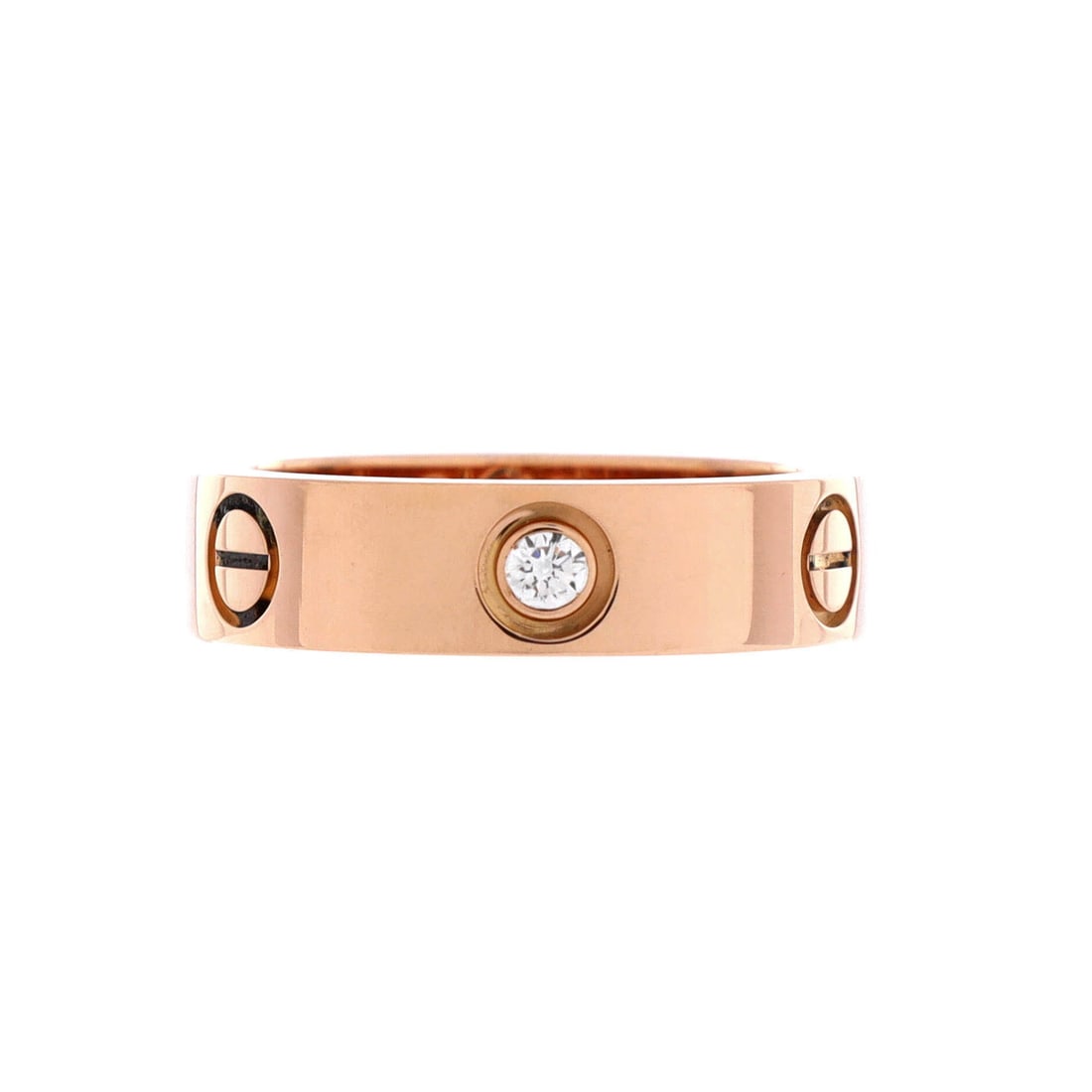 Cartier Love 3 Diamonds Band Ring 18K Rose Gold with Diamonds: Three diamonds take the place of screw heads along this rose gold Love band, spaced to catch light in sequence as the hand moves. The 5.45 mm width reads as a real band rather than a stacker, wide eno