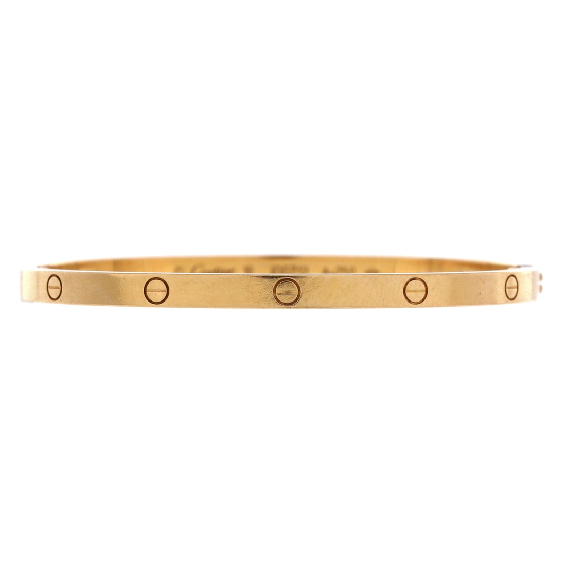 Cartier Love Bracelet 18K Yellow Gold: Yellow gold at 3.6 mm is the small model Love bangle, the width most people wear two or three of at once. The screw system makes it a commitment rather than a piece you swap out daily. Grade D - Good,