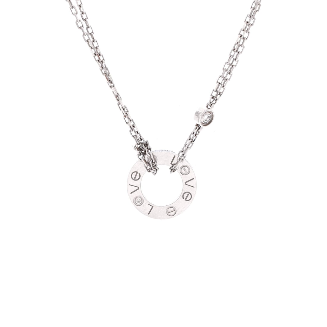 Cartier 2 Diamonds Love Pendant Necklace 18K White Gold with Diamonds: White gold cools the Love motif down, and two diamonds read brighter against it than they do in yellow. The 13 mm pendant rides a chain adjustable from 15 to 16 inches, high on the chest. Grade C - Ve