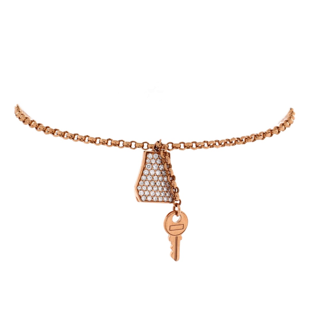 Hermes Kelly Clochette Chain Bracelet 18K Rose Gold with Pave Diamonds: Hermes shrinks the clochette, the little leather bell that carries a Kelly's key, into a rose gold charm and hangs it from a pave-set chain. It reads as an in-joke to anyone who knows the house, discr
