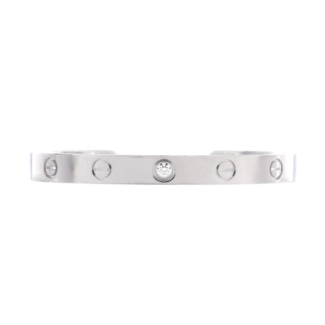Cartier Love 1 Diamond Cuff Bracelet 18K White Gold with Diamond: The open-back cuff version of the Love bangle slides on over the wrist with no screwdriver involved, which is its argument for anyone who takes jewelry off at night. White gold keeps the screw motif c