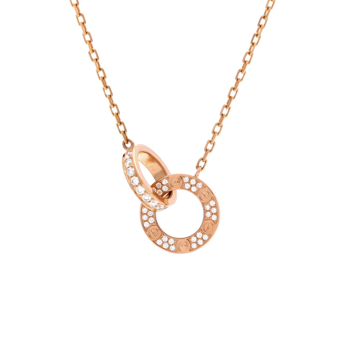 Cartier Love Interlocking Pave Necklace 18K Rose Gold and Diamonds: Full pave across both interlocking circles turns this into an evening piece, the 0.75 in motif reading as continuous light rather than as gold. The chain adjusts between 14.75 and 16 in, so it can be 