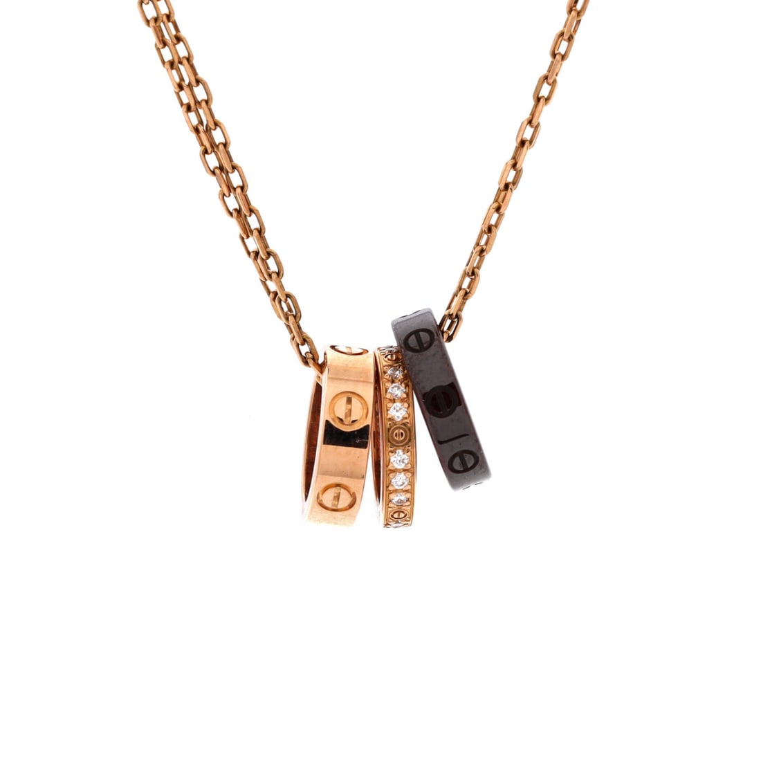 Cartier Love 3 Ring Pendant Necklace 18K Rose Gold and Ceramic with Diamonds: Ceramic against rose gold changes the pendant's read entirely, the matte ring throwing gold and diamonds into contrast. Three interlocking bands make up the motif, 10.8 by 7.7 mm across and visually h