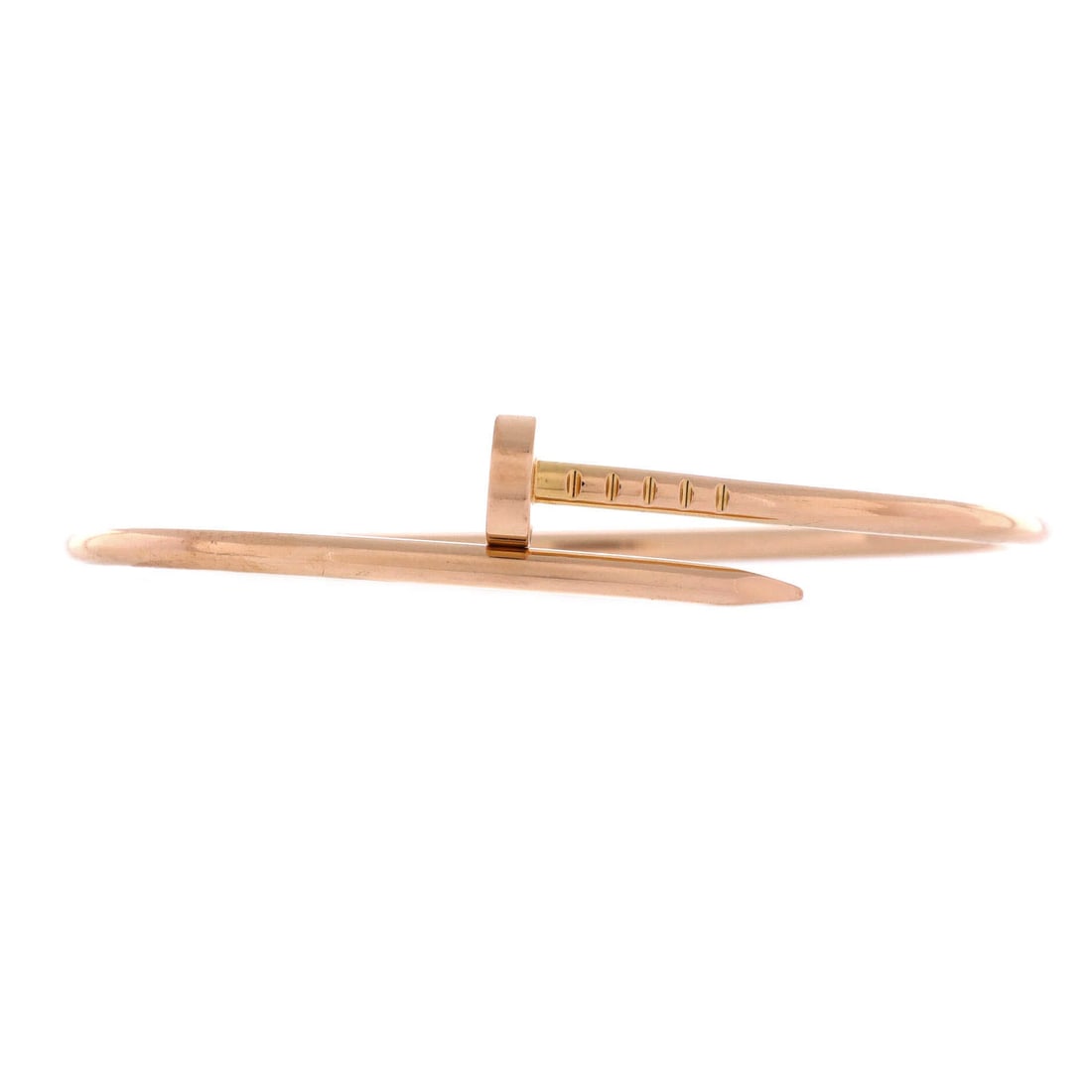 Cartier Juste un Clou Bracelet 18K Rose Gold: The nail head sits proud of the wrist on this rose gold bracelet, its point tucking under on the opposite side to complete the wrap. Slim at 2.5 mm, it holds the graphic line without adding bulk benea
