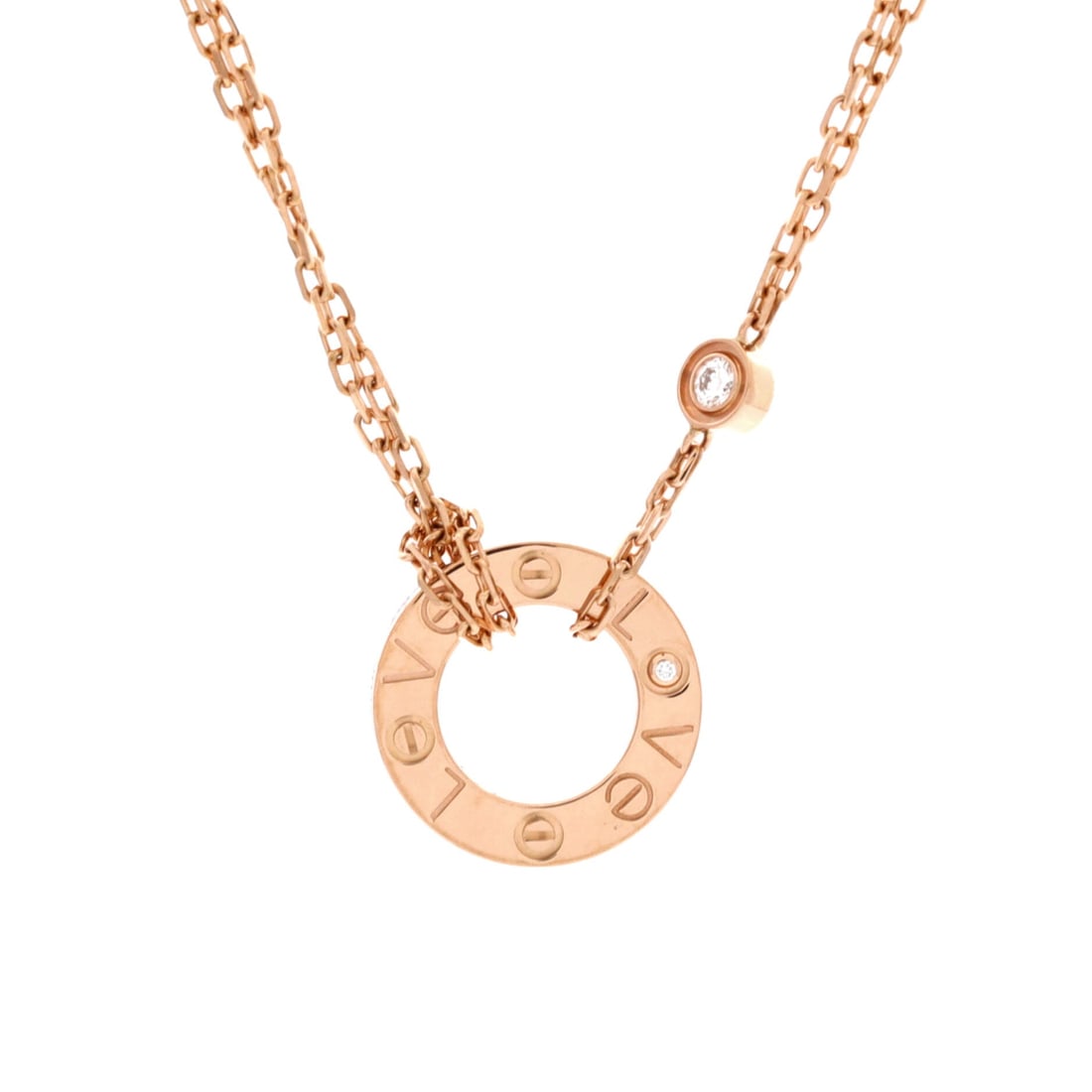 Cartier 2 Diamonds Love Pendant Necklace 18K Rose Gold and Diamonds: Rose gold warms the Love motif, and at 13 mm square the pendant stays a detail rather than a statement. The chain adjusts between 15 and 16.25 inches, so it can sit at the base of the throat or drop j