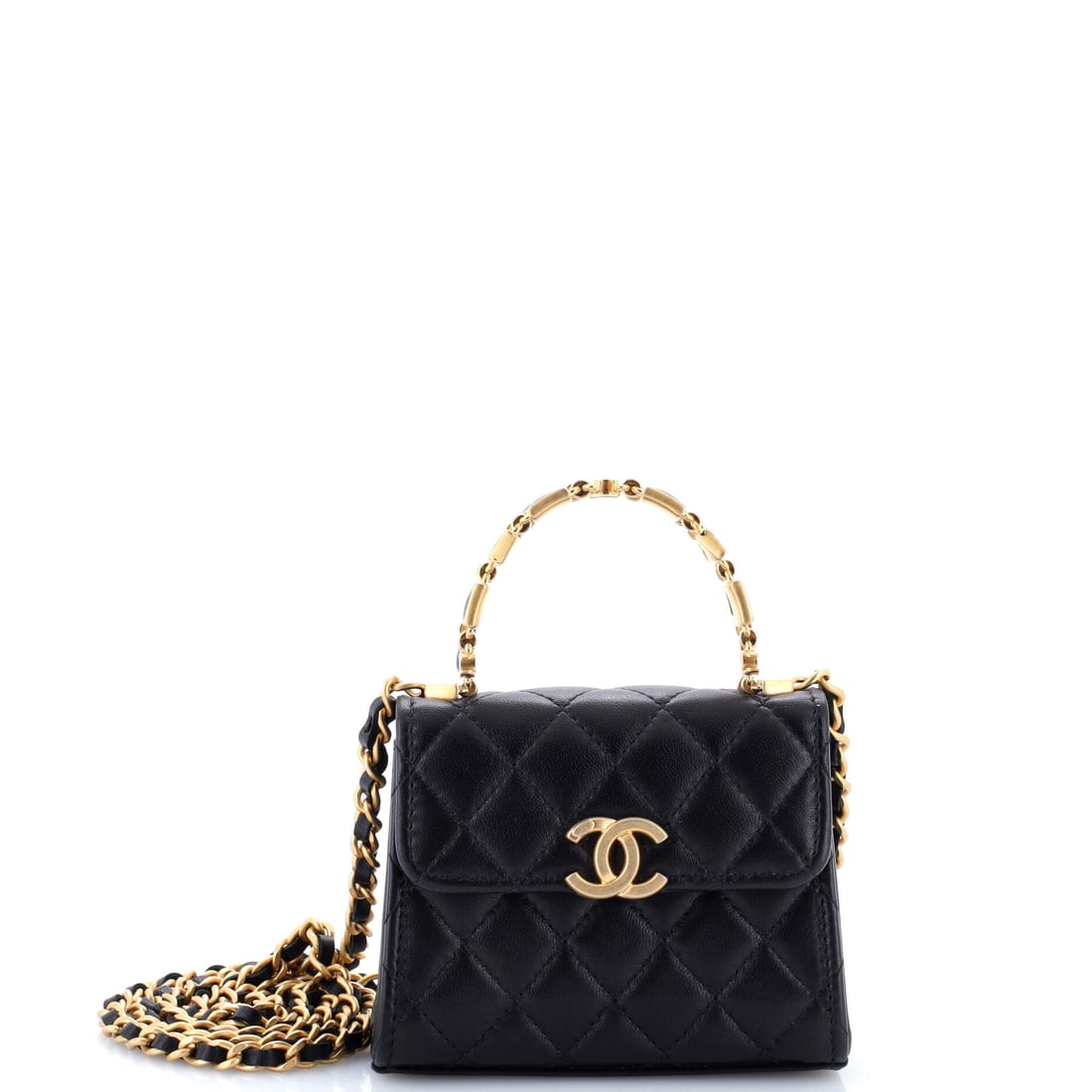 Chanel Coco Enamel Top Handle Flap Bag Quilted Lambskin: Tiny by any measure at 4.5 by 3.5 inches and 1.5 inches deep, this enamel-trimmed top handle flap functions as an accessory first and a bag second. Grade A - Pristine. Enamel against quilted lambskin 