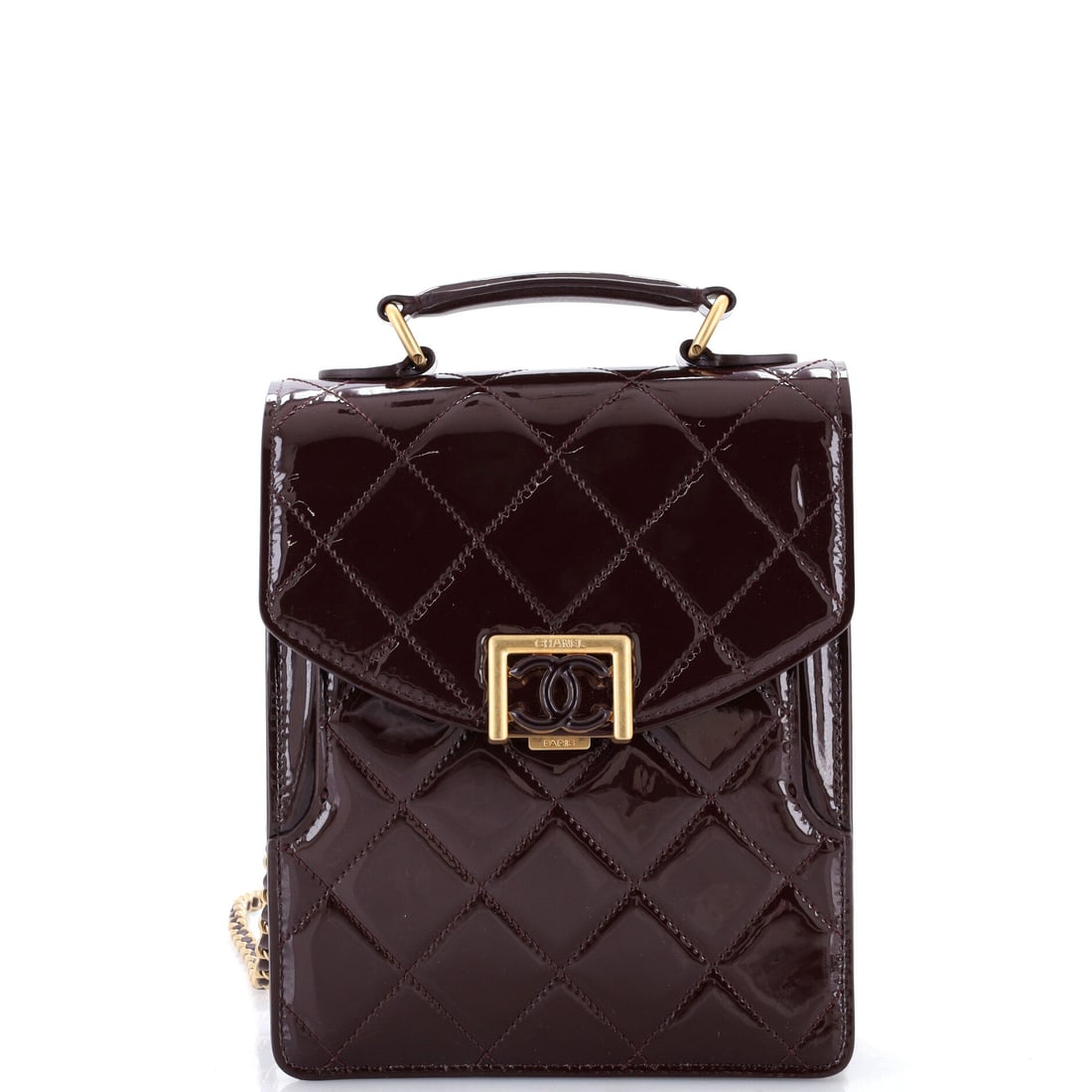 Chanel CC Vertical Top Handle Chain Flap Bag Quilted Patent: Vertical proportions set this flap apart: 8.5 inches tall against 6.5 wide, so it reads upright rather than letterbox. Quilted patent catches light along every channel, and the 1 inch top handle is fo