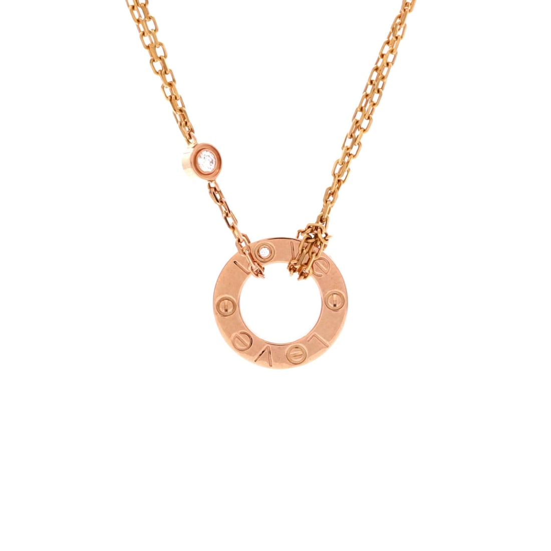 Cartier 2 Diamonds Love Pendant Necklace 18K Rose Gold and Diamonds: At 16.5 to 17.75 inches this is the longer chain in the Love pendant range, falling below the collarbone where a shorter piece can sit above it. The 13.05 mm rose gold plaque keeps the screw pattern i