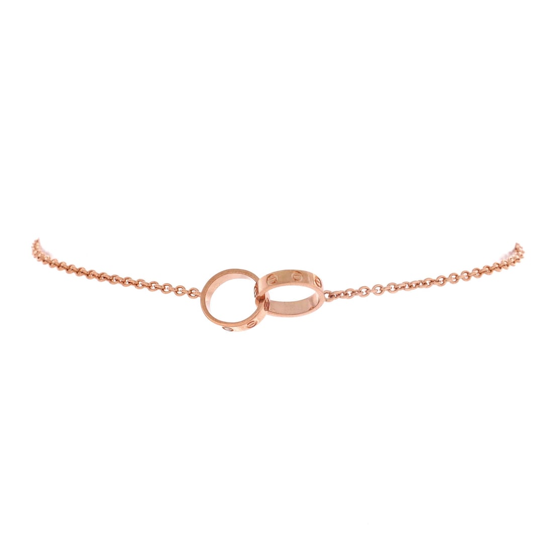 Cartier Love Interlocking Bracelet 18K Rose Gold: Cartier's Love Interlocking bracelet strips the collection back to essentials: two linked circles carrying the screw motif, hung from a fine 18K rose gold chain. The warm alloy keeps the piece soft ag