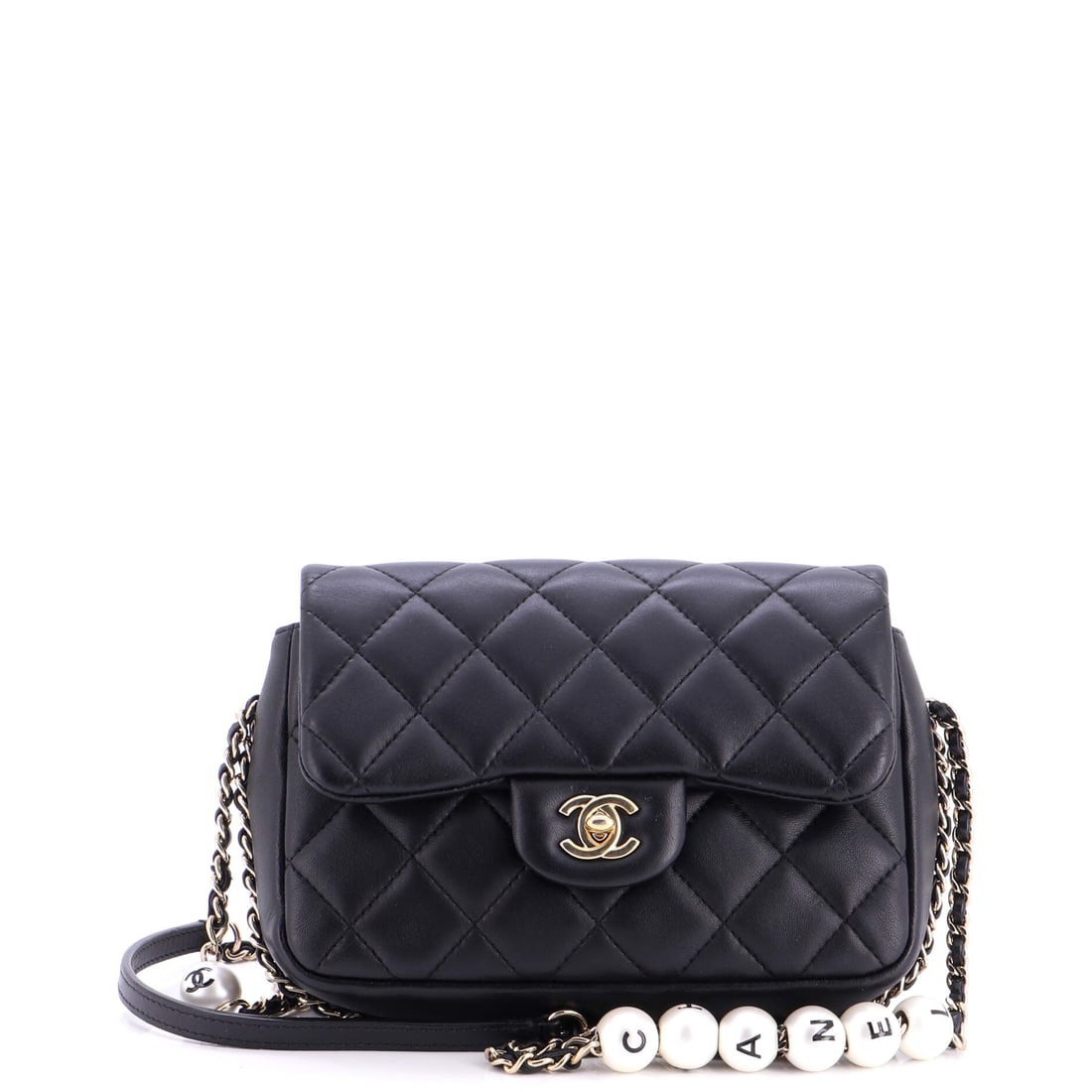 Chanel My Precious Pearls Chain Flap Bag Quilted Lambskin: Pearls threaded through the chain are the signature of the My Precious line, and they change how the strap sits, softer and quieter than metal alone. The body runs 8 by 6 inches with 2.5 inches of dep