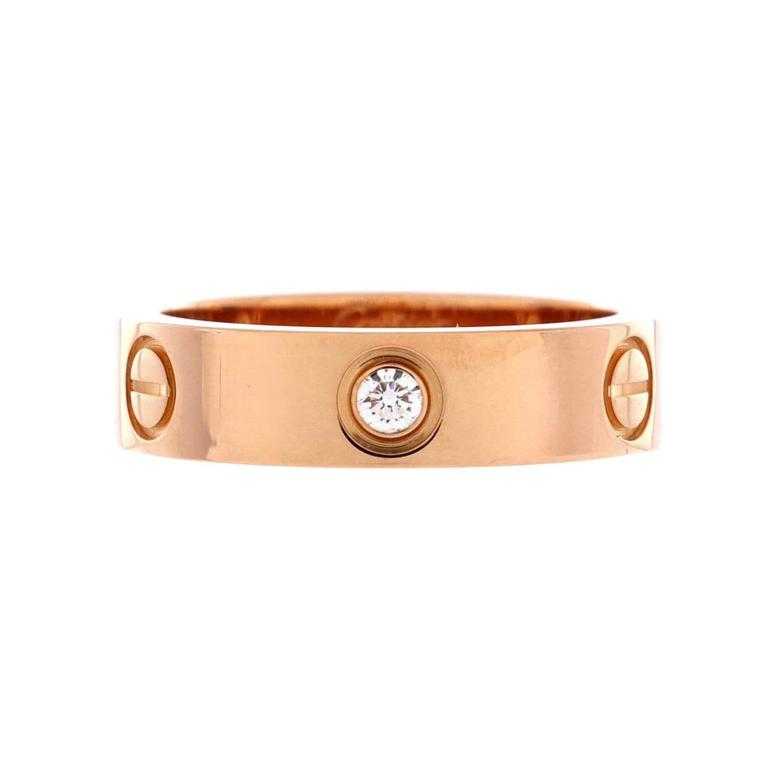 Cartier Love 3 Diamonds Band Ring 18K Rose Gold with Diamonds: Rose gold and three flush-set diamonds give the Love band its dressier register, the stones reading as jewelry while the screws hold the hardware idea intact. Grade B - Excellent. The 5.45 mm profile 