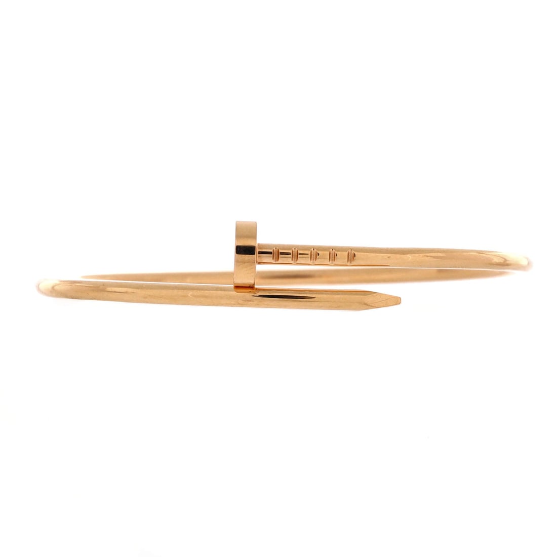 Cartier Juste un Clou Bracelet 18K Rose Gold: Wrapped around the wrist rather than clasped across it, the Juste un Clou takes its shape from a single nail, head at one end and point at the other. Rose gold gives that industrial reference a softer