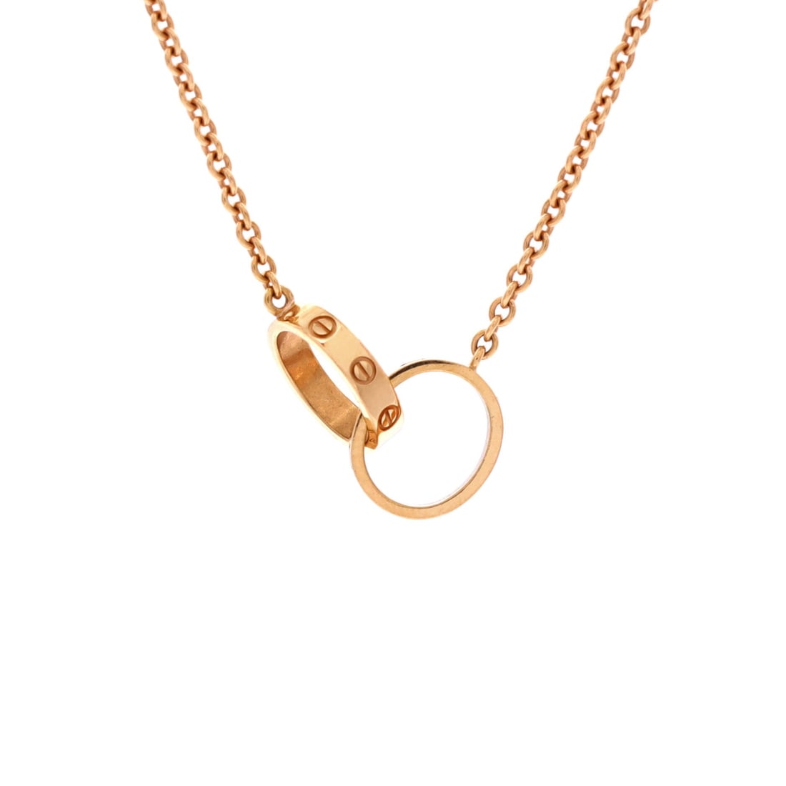 Cartier Love Interlocking Necklace 18K Rose Gold: Two screw-motif circles lock through one another at the throat on this Love necklace, hung on a 17.25 in 18K rose gold chain that lands just under the collarbone. At 0.75 in across and only 2.6 mm thi
