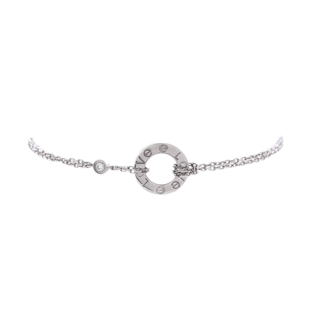 Cartier 2 Diamonds Love Bracelet 18K White Gold with Diamonds: The Love bangle's screw motif reads cooler in 18K white gold, where two flush-set diamonds take the place of two screw heads. It is a rigid oval, so it locks to the wrist instead of swinging, and it s