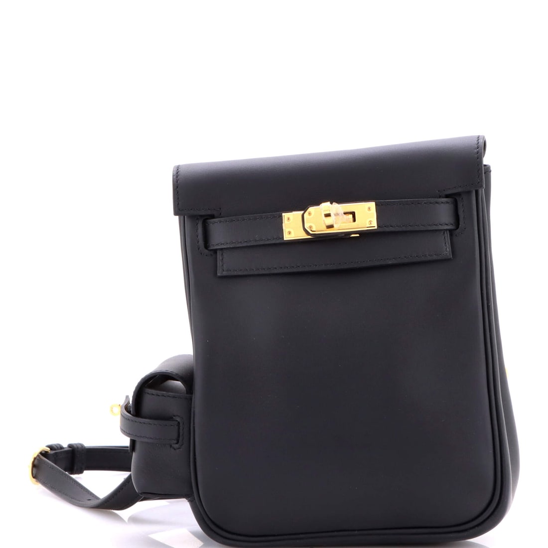 Hermes Kelly Jump Backpack Swift: Backpack scale here is deliberately tight, 9 in tall and 3 in deep, worn high on the back rather than slung low. Swift's fine grain keeps the panels crisp, and the Kelly detailing survives the transla