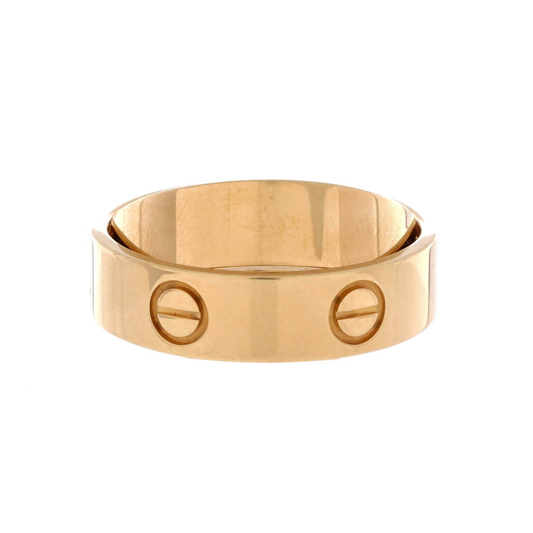 Cartier Astro LOVE Ring 18K Yellow Gold: Cartier's Astro Love ring takes the screw motif around a 5.5 mm band of 18K yellow gold, wide enough to hold its own beside a bangle from the same line. That width reads as a statement ring rather tha