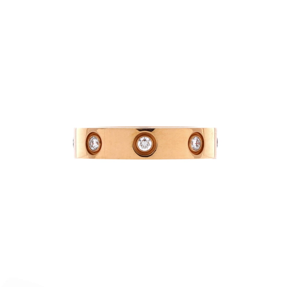 Cartier Love Wedding Band 8 Diamonds Ring 18K Rose Gold with Diamonds: A 4 mm width gives this diamond-set Love band more mass than most wedding rings, and the eight stones alternate with screw heads around the full circle. Rose gold warms the diamonds slightly instead o