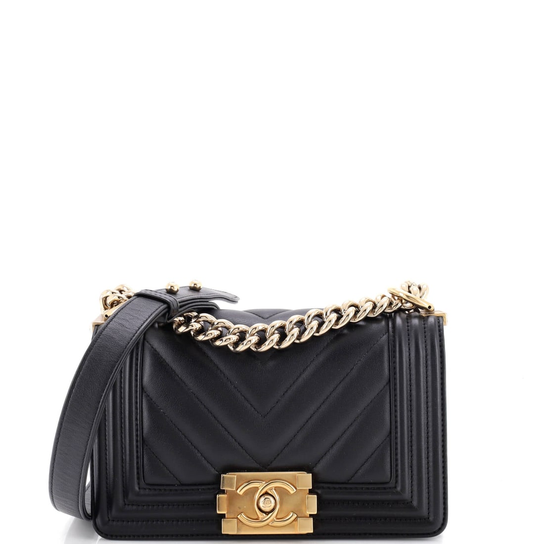 Chanel Boy Flap Bag Chevron Calfskin: Architectural is the right word for the Boy: a rigid frame, a flat base, and a clasp that closes with a mechanical snap. In chevron calfskin at 8 inches wide, 5 high and 3 deep, it holds its rectangle