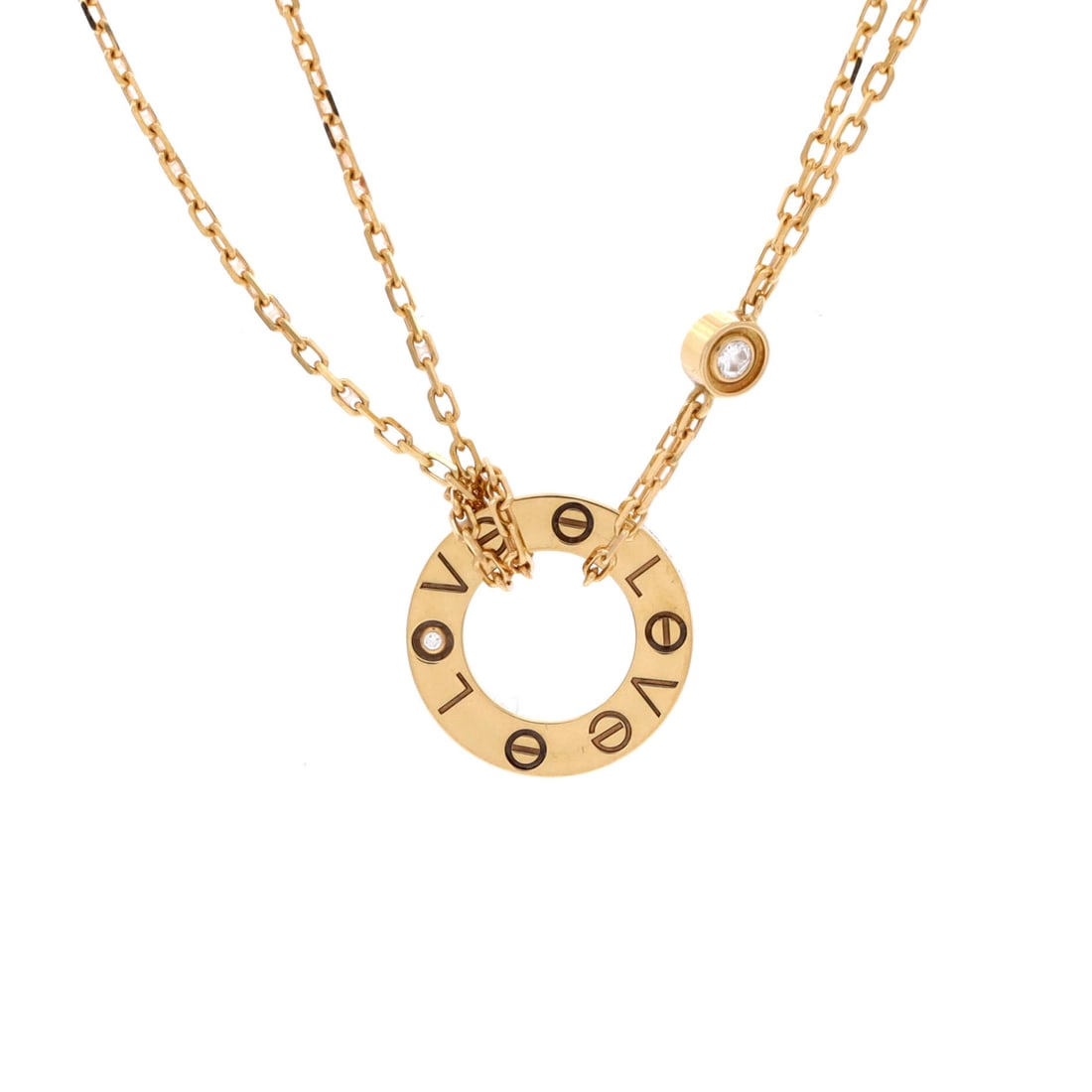 Cartier 2 Diamonds Love Pendant Necklace 18K Yellow Gold and Diamonds: Short chain, small plaque: at 14.75 to 16 inches with a 13 mm motif, this yellow gold Love pendant sits close to the throat and stays visible above a crew neck. Two diamonds interrupt the screw patter