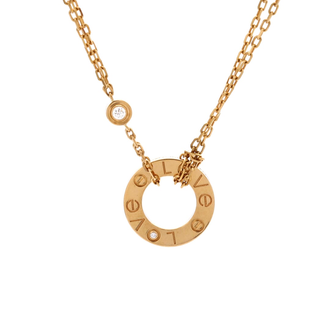 Cartier 2 Diamonds Love Pendant Necklace 18K Yellow Gold and Diamonds: Two brilliants replace two screws on the yellow gold plaque, and at 13.05 mm the entire motif is narrower than a fingertip. The chain adjusts from 15 to 16.25 inches, covering most necklines without a