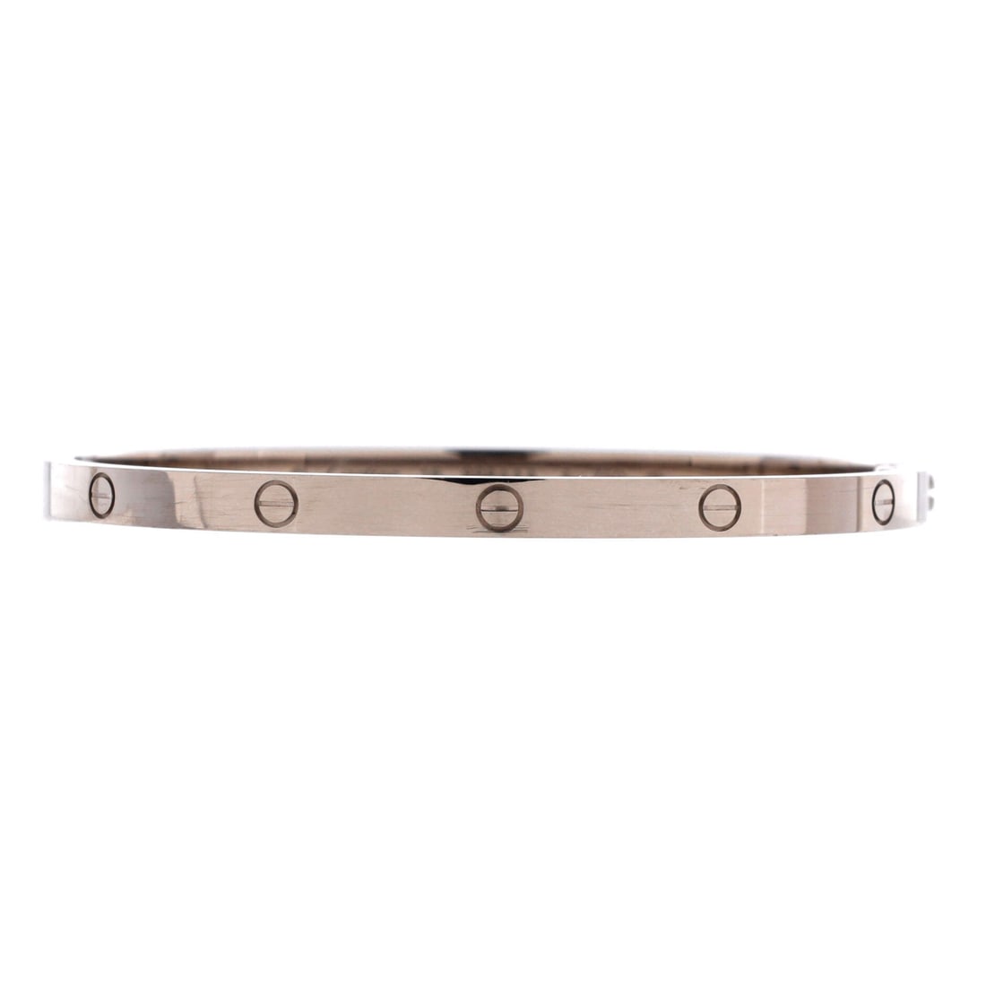 Cartier Love Bracelet 18K White Gold: Slim white gold, 3.65 mm wide, gives this Love bangle the small model proportion that suits a narrower wrist. The construction is the familiar one: two halves, two screws, no clasp. Grade B - Excellen