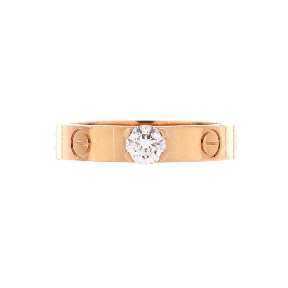 Cartier LOVE Solitaire Ring 18K Rose Gold and Diamond: A single diamond interrupts the screw sequence on this Love Solitaire in 18K rose gold, lifting the band above the plain version without softening its hardware logic. The 3.6 mm width gives more prese