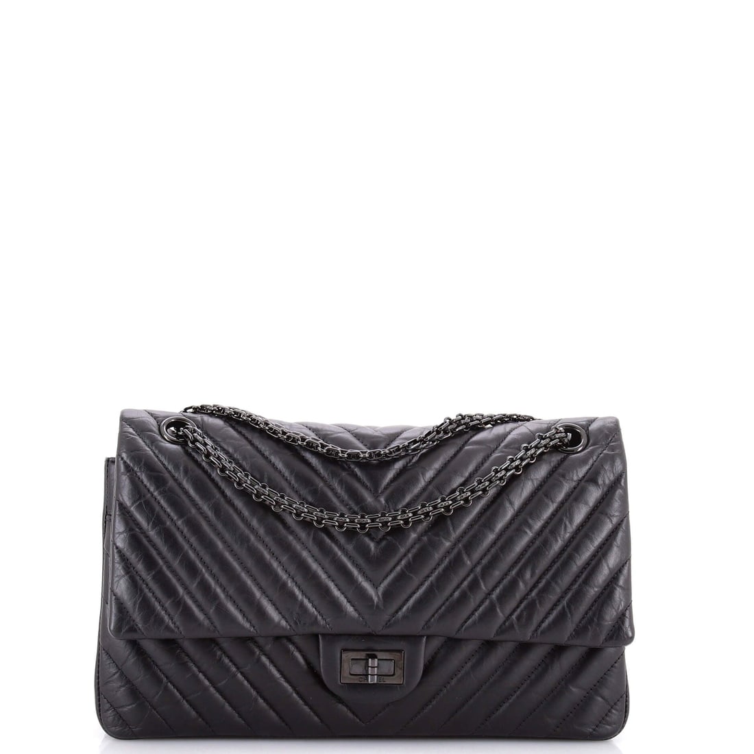 Chanel So Black Reissue 2.55 Flap Bag Chevron Aged Calfskin: Chevron rather than diamond quilting, blacked out, on an 11 in Reissue body: the effect is graphic and unusually restrained. The mademoiselle lock loses its metal contrast, so the chevron lines carry 