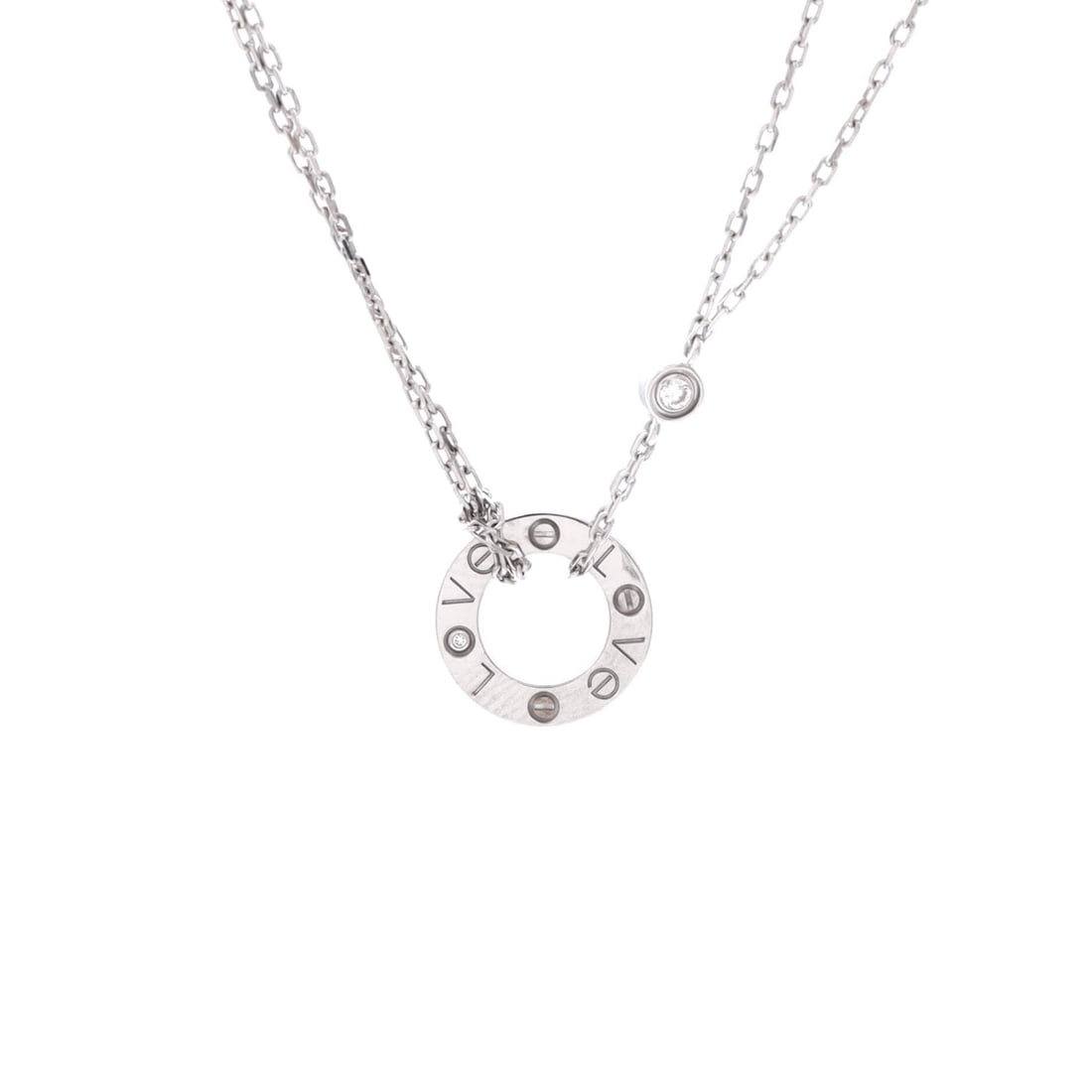 Cartier 2 Diamonds Love Pendant Necklace 18K White Gold with Diamonds: 18K white gold, two diamonds, a 13 mm plaque: the Love pendant reduces the bracelet's language to its smallest legible form. The chain travels between 15 and 16.25 inches, enough range to clear a high