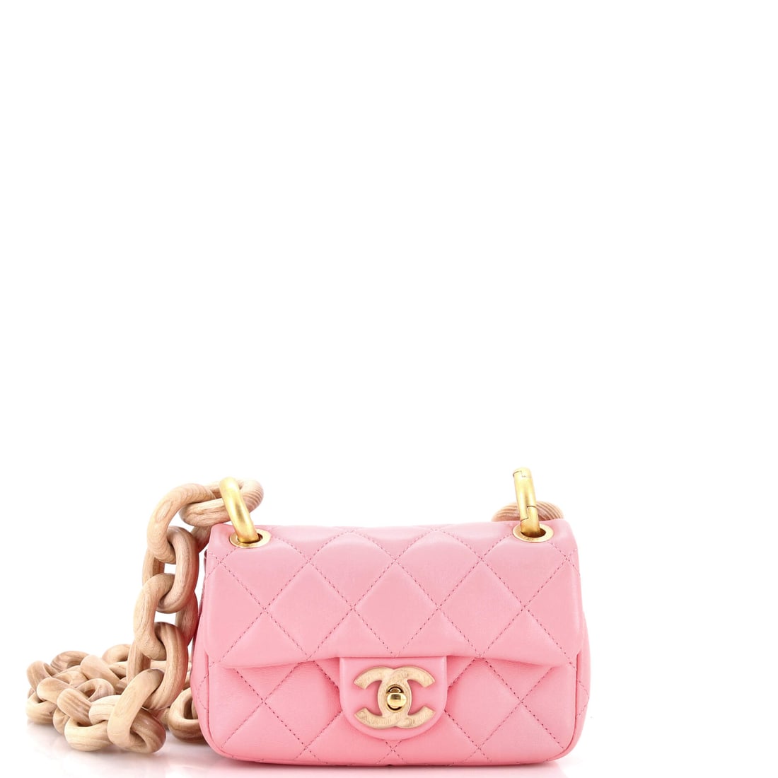 Chanel Wenge Wood Flap Bag Quilted Lambskin: Wenge wood detailing is the whole conversation here, warm against quilted lambskin on a compact 7 x 4.5 x 3 in flap. Three inches of depth give the small footprint unexpected volume. Grade B - Excelle