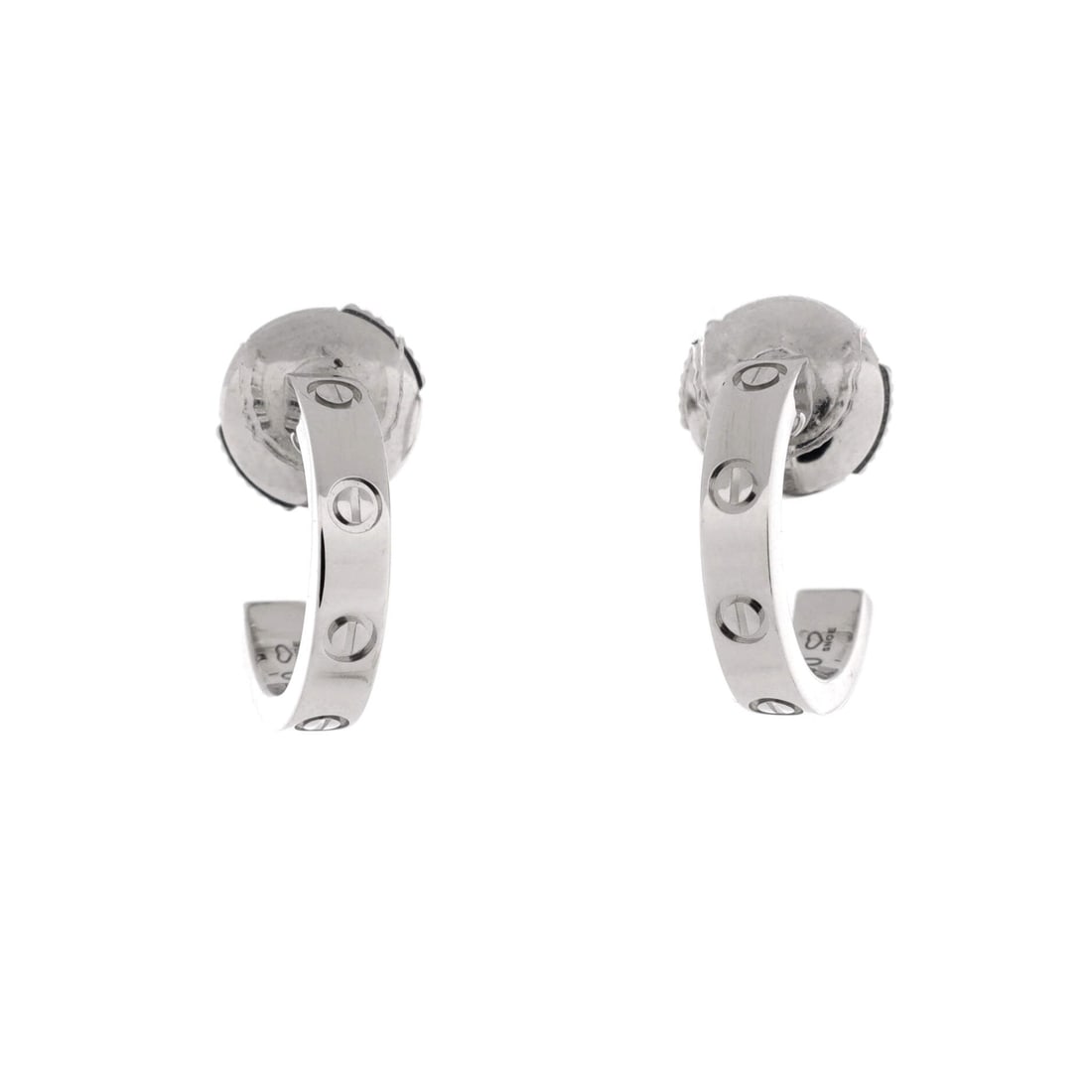 Cartier Love Hoop Earrings 18K White Gold: White gold hoops in the small size, 12.45 mm of drop and 2.6 mm across, made to sit close against the lobe. The cool metal makes the screw motif look more mechanical than decorative at this scale. The