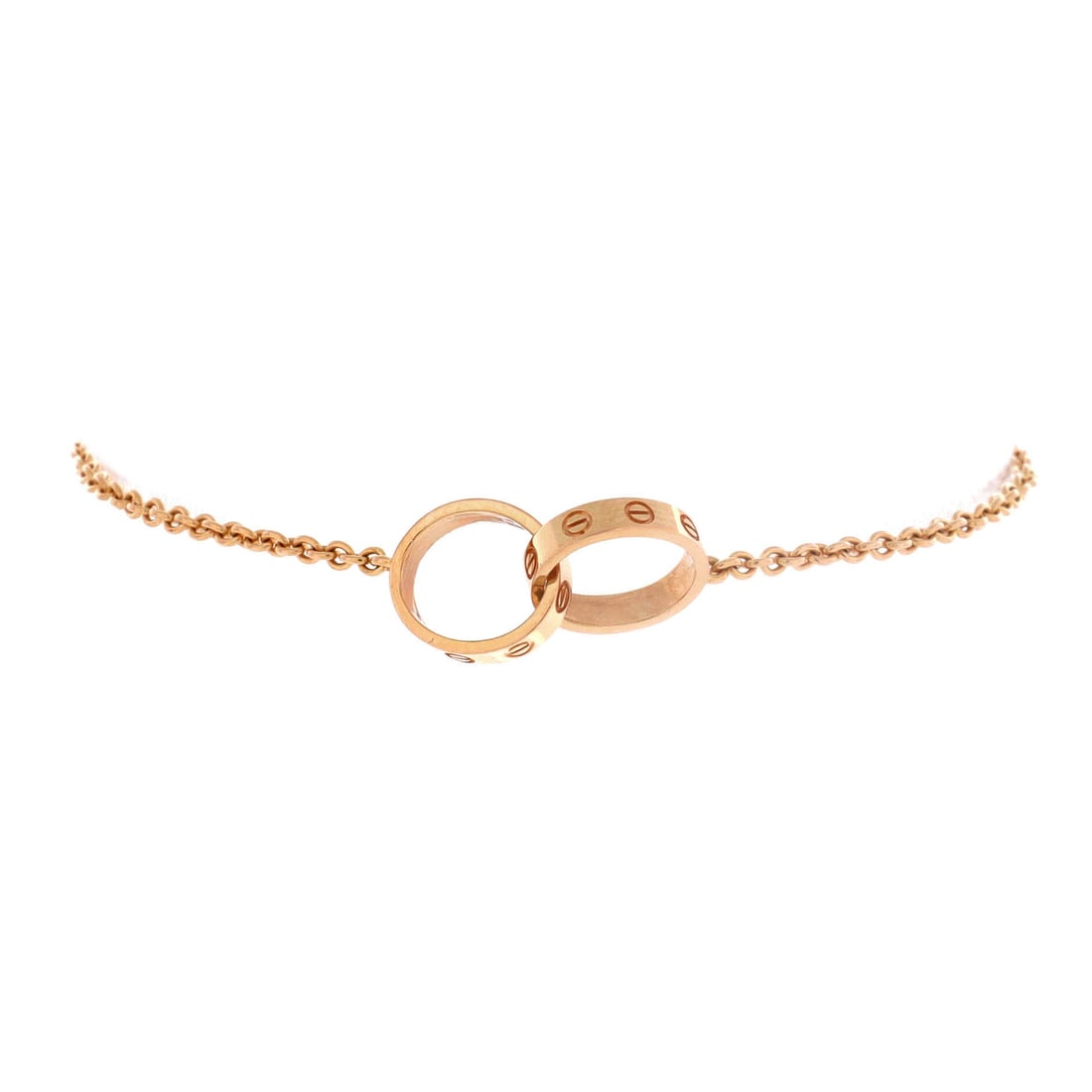 Cartier Love Interlocking Bracelet 18K Rose Gold: Screw heads are the whole argument for the Love line, and they appear in miniature here across two interlocked rose gold circles. Cartier keeps the 18K chain deliberately fine so the motif carries the