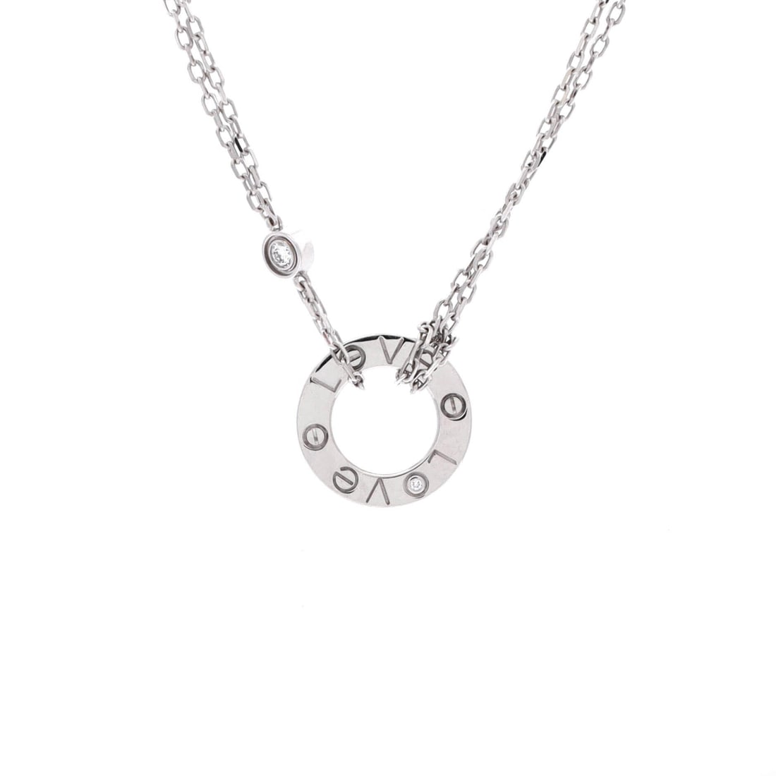Cartier 2 Diamonds Love Pendant Necklace 18K White Gold with Diamonds: Pared back to essentials, the Love pendant in 18K white gold sets two diamonds into a screw-marked plaque and leaves the rest of it alone. Cool metal suits a wearer whose other pieces are platinum or 