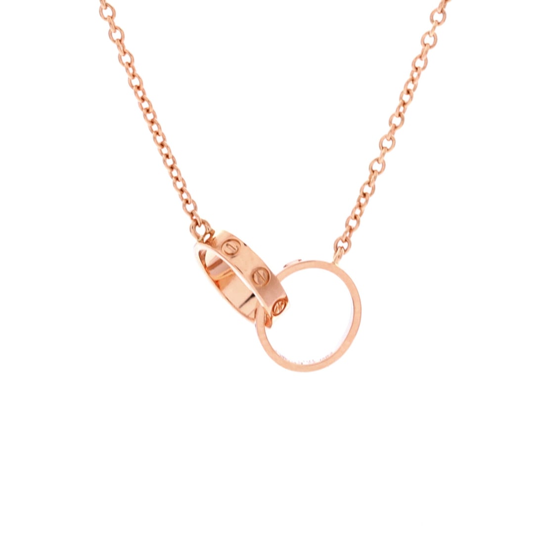 Cartier Love Interlocking Necklace 18K Rose Gold: At 16.75 in this is the shorter chain among the rose gold Love necklaces here, sitting nearer the throat and reading higher against an open collar. The 0.75 in double-circle motif holds a 2.6 mm profi