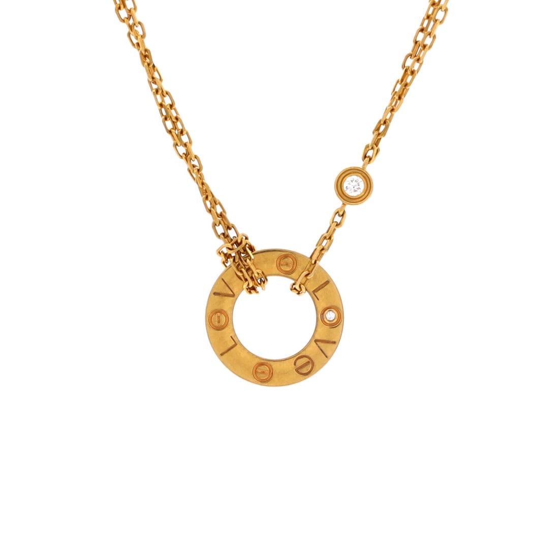 Cartier 2 Diamonds Love Pendant Necklace 18K Yellow Gold and Diamonds: Compact at 13.05 mm on a 14.75 to 16 inch chain, this yellow gold Love pendant is scaled for close-to-the-neck wear. Two diamonds sit inside the screw pattern, flush and unobtrusive. Offered in Grade 