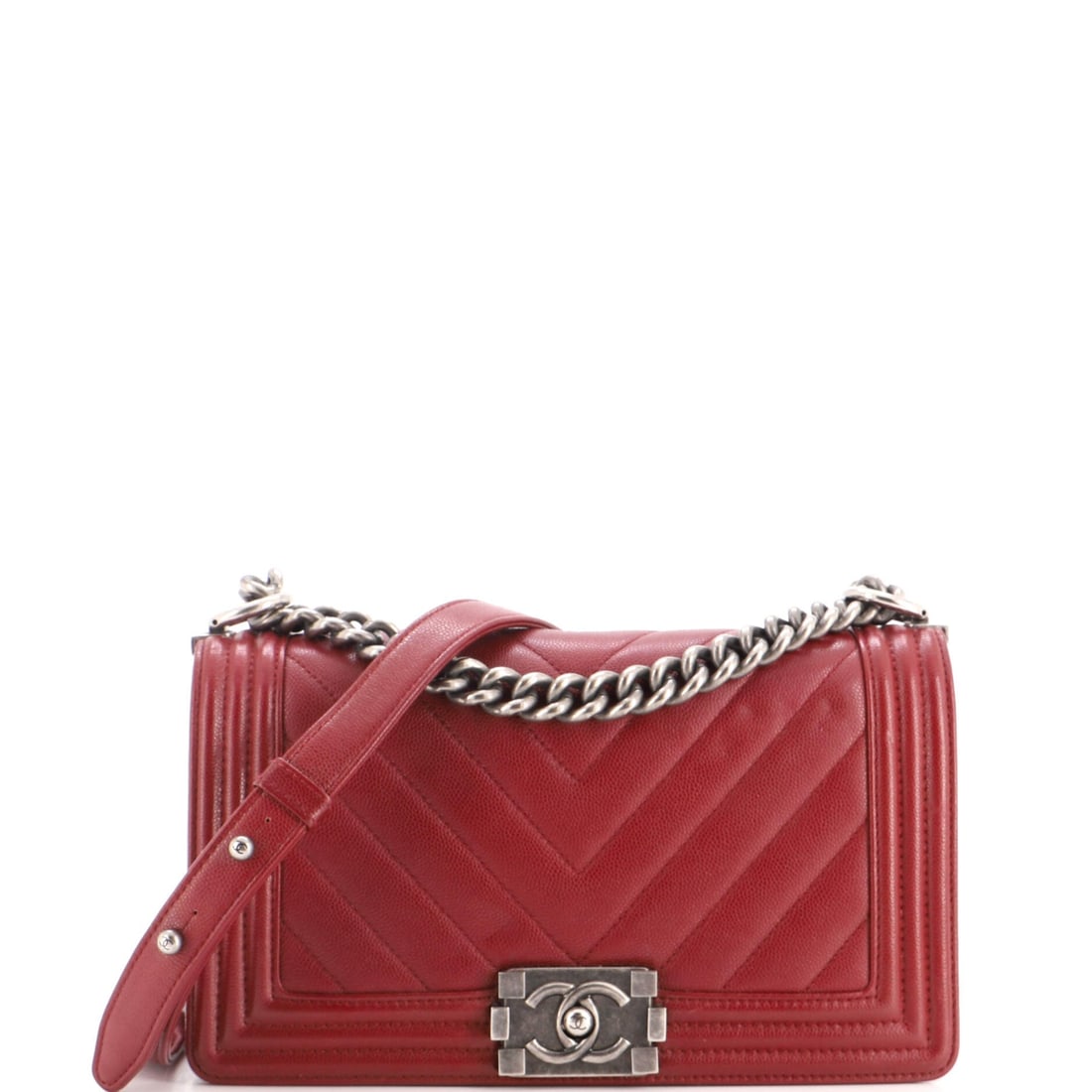 Chanel Boy Flap Bag Chevron Caviar: Grained caviar and chevron stitching are a practical pairing, and on this Boy they cover a 9.5 by 6 inch front with 3 inches of depth behind it. The frame stays square under weight. Grade B - Excellen