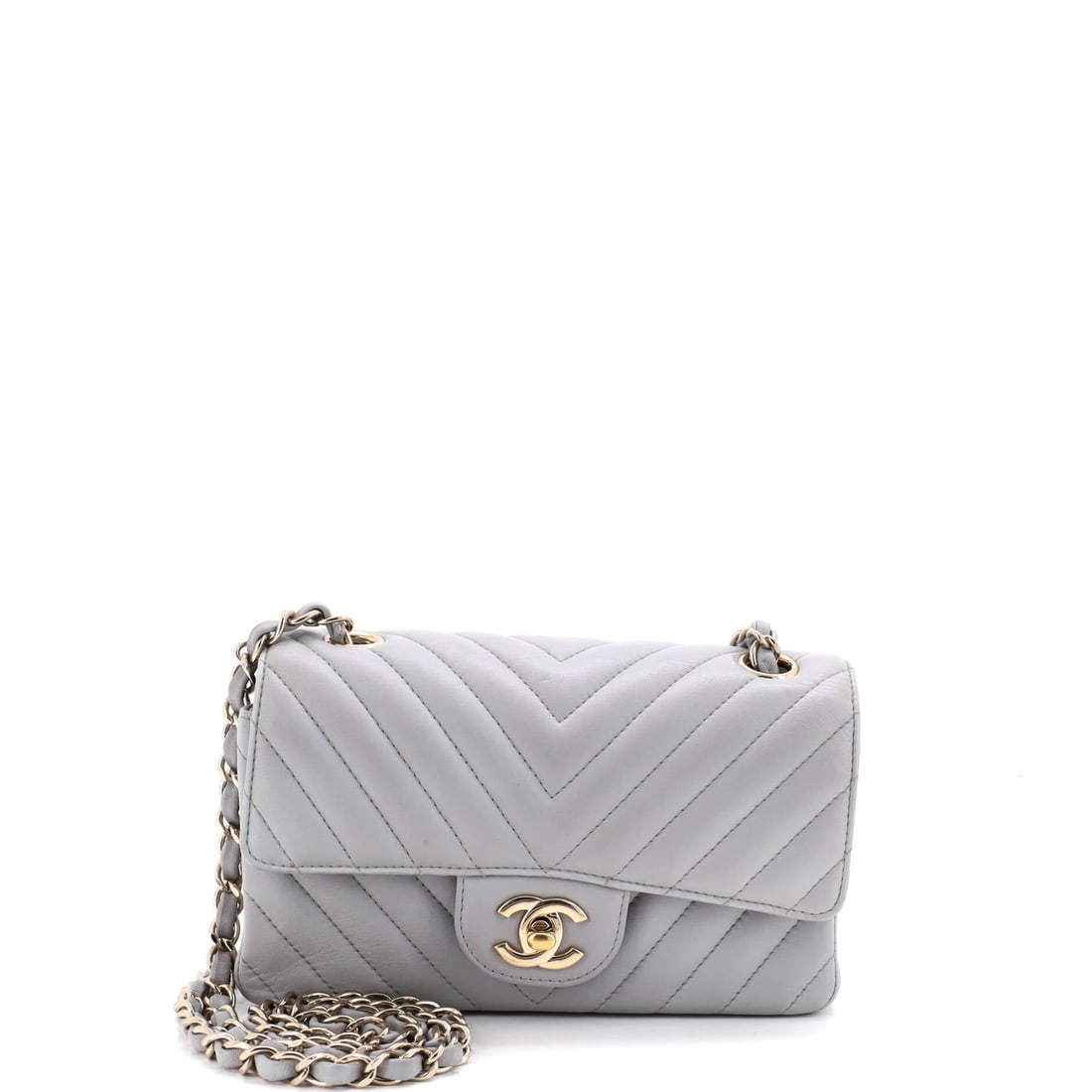 Chanel Classic Single Flap Bag Chevron Lambskin: Lambskin in chevron takes light differently from diamond quilting, the stripes running continuous across the flap with a softer sheen. At W 7.5 x H 5 x D 2.5 in this is the small-medium end of the sin