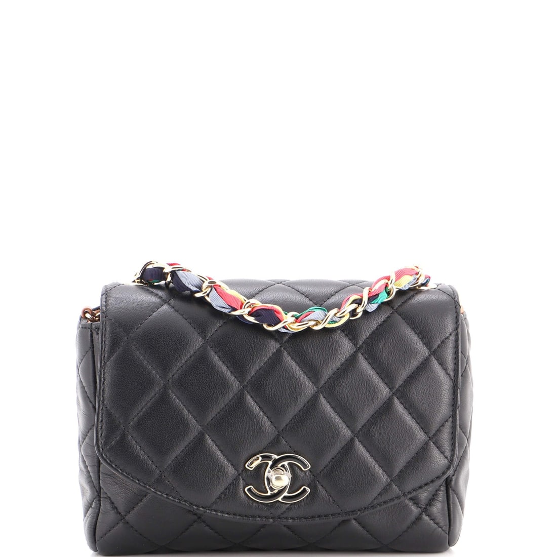 Chanel RIbbon Chain Flap Bag Quilted Lambskin: Ribbon laced through the chain softens the hardware and shifts this flap toward something dressier than the standard treatment. The condition reads Grade B - Excellent. Quilted lambskin underneath kee