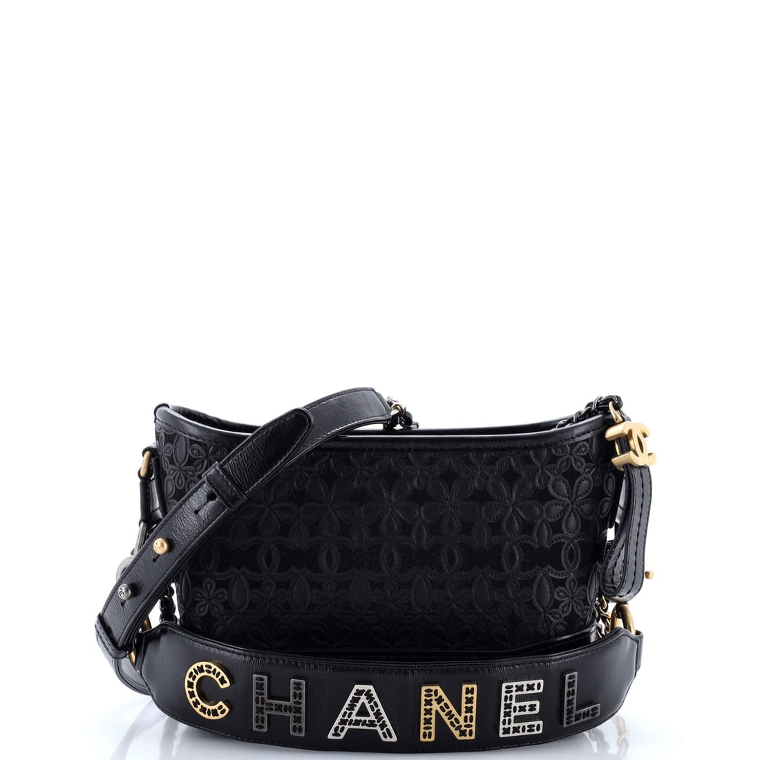 Chanel Gabrielle Hobo with Logo Handle Laser Cut Calfskin and Wool Felt: Laser-cut calfskin layered over wool felt is an unusual pairing, and on the Gabrielle it produces a matte, textile-backed surface with cut-out pattern in place of stitched quilting. The body measures 