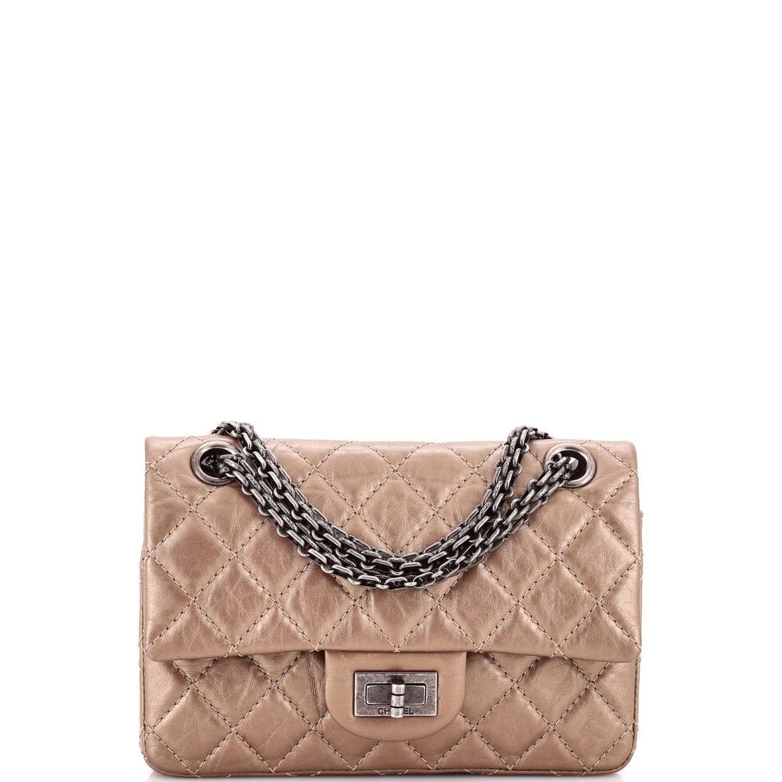 Chanel Reissue 2.55 Flap Bag Quilted Aged Calfskin: Quilted aged calfskin on the compact 2.55 gives you the line's dry, broken-in surface in a 7.5 in body that suits a smaller frame. The rectangular turn-lock and woven chain are the whole design vocabu