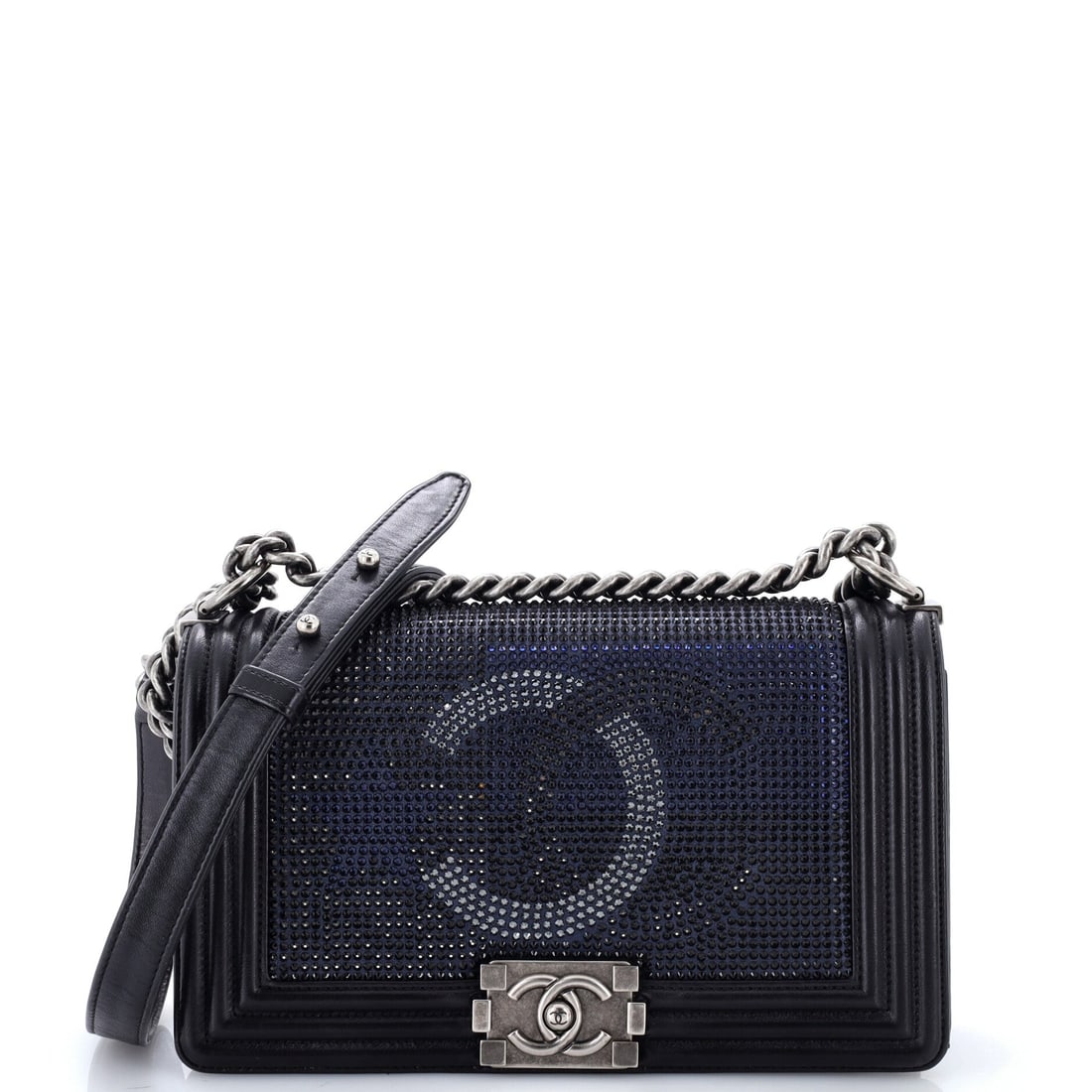 Chanel Paris-Dallas Boy Flap Bag Limited Edition Metallized Strass: Metallized strass covers the quilting on this Paris-Dallas Boy, giving the flap a hard glitter rather than a soft sheen. Ten inches wide by six high with a three inch depth, it sits in the medium rang