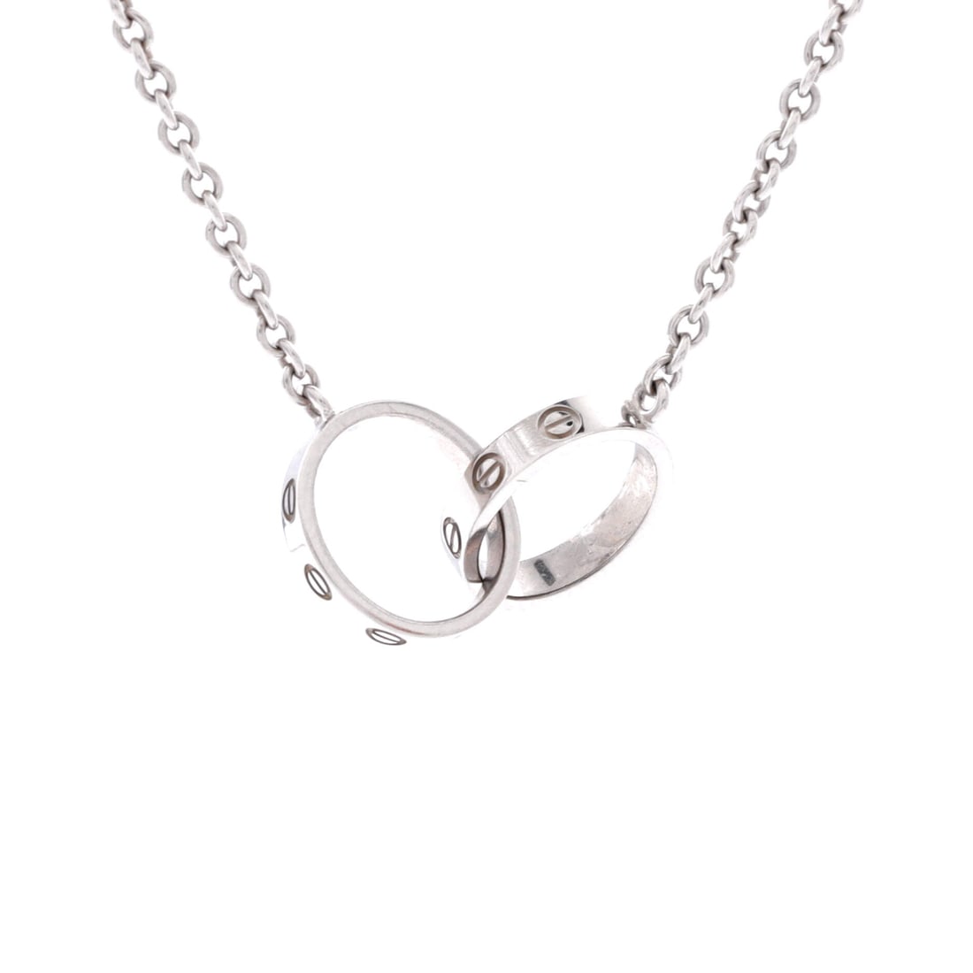 Cartier Love Interlocking Necklace 18K White Gold: White gold sends the Love motif in a cooler direction, and the interlocking circles here, 0.75 in wide at 2.55 mm thick, read almost like polished steel against the skin. The chain measures 17.25 in. 