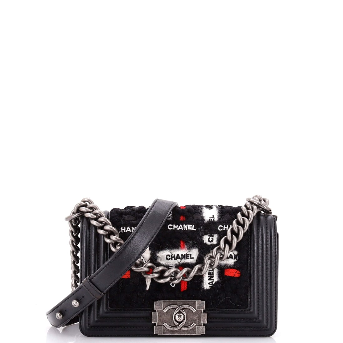 Chanel Boy Flap Bag Quilted Logo Ribbon and Tweed: Tweed with quilted logo ribbon is a fabric proposition rather than a leather one, putting this model in a different register: textural, soft-edged, still framed and clasped like the rest. Squarer than