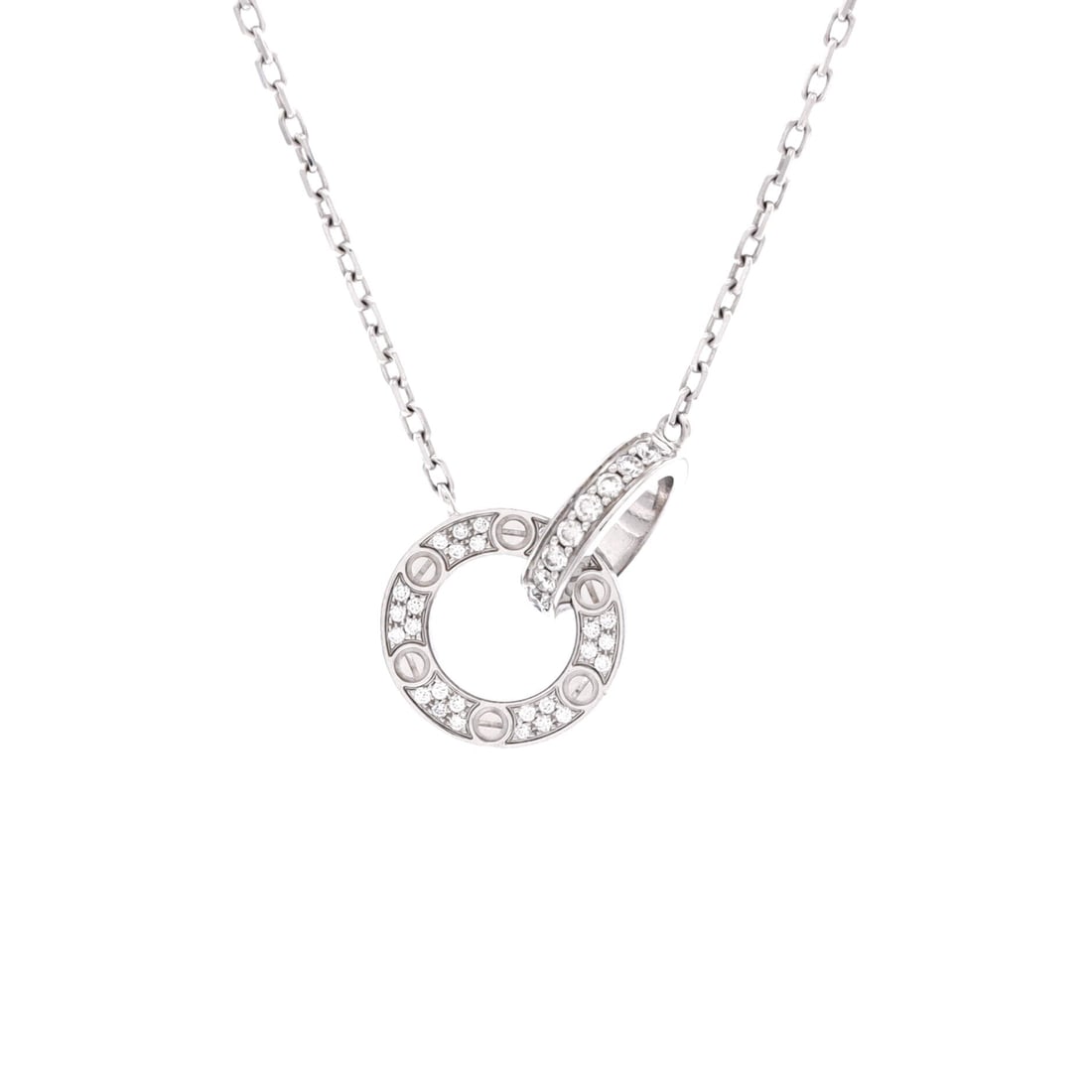Cartier Love Interlocking Pave Necklace 18K White Gold and Diamonds: Motif dimensions of 13 by 20 mm put this pave pendant among the larger reads in the group, enough to hold a plain black neckline on its own. The white gold chain adjusts across 14.75 to 16 in. Grade C