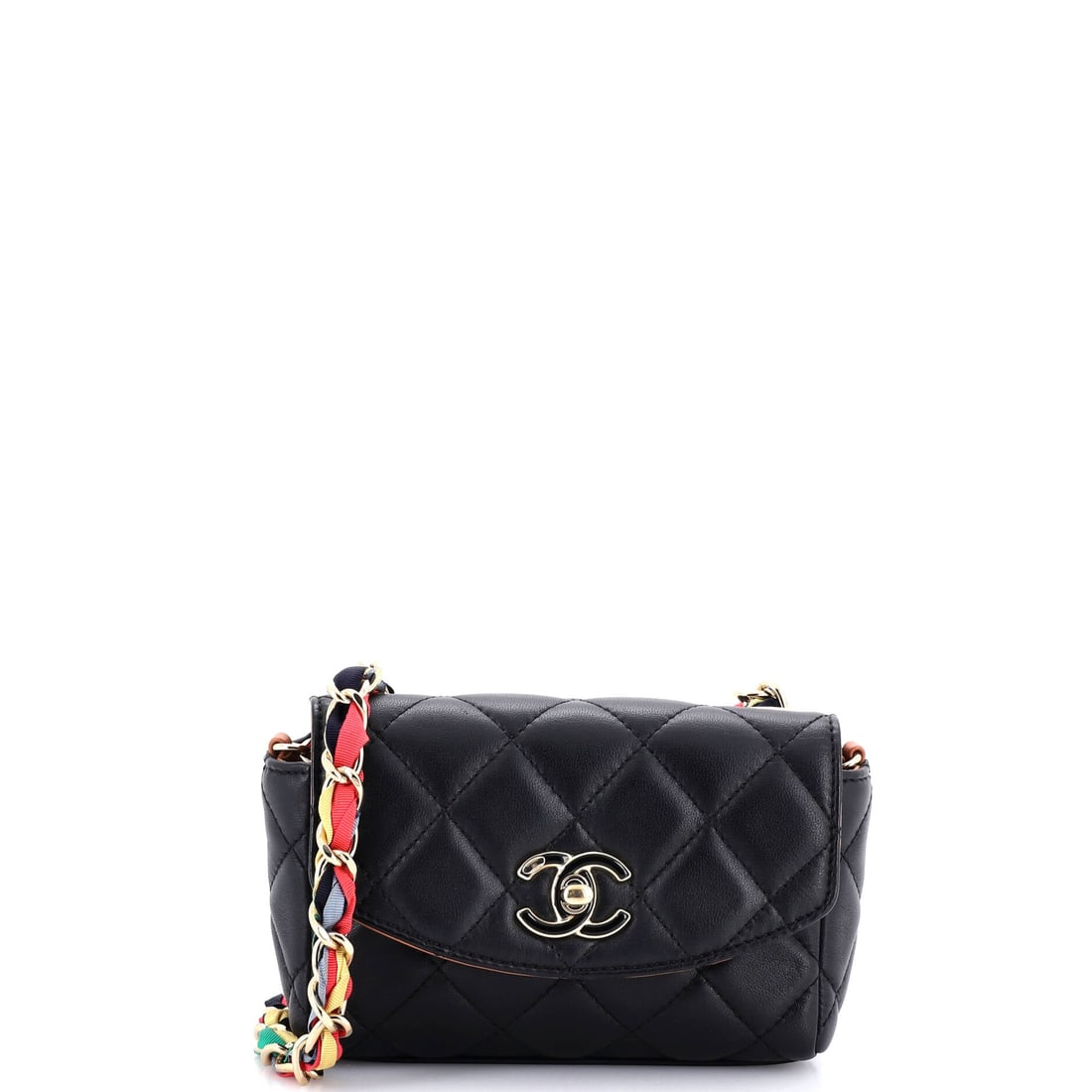 Chanel RIbbon Chain Flap Bag Quilted Lambskin: Small enough to read as an evening bag at six by 4.5 inches, this ribbon-chain flap still hangs on a 21.5 inch drop for crossbody wear. Two inches of depth keeps the profile flat. The woven ribbon thr